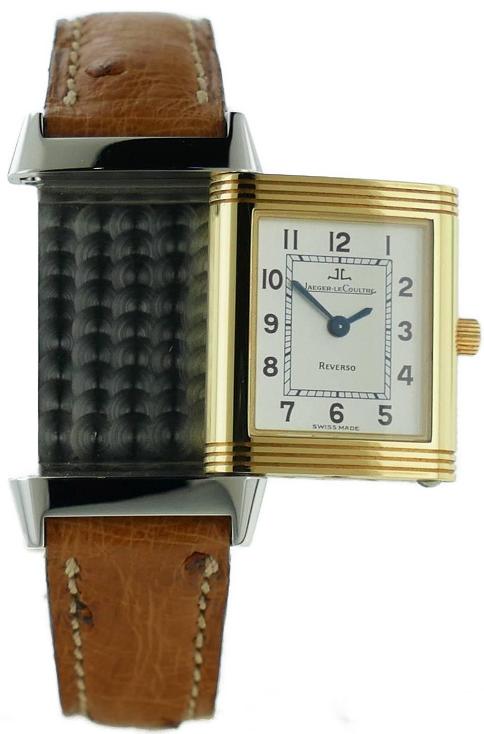 Ladies (20x28mm) Jaeger LeCoultre Reverso 18k Yellow Gold & Stainless Steel Watch, Ref 260.5.08. The Watch is in Great Condition & Keeping Perfect Time; Movement is Battery Operated. The Watch is on a Jaeger Ostrich Strap & Jaeger Deployment Buckle.