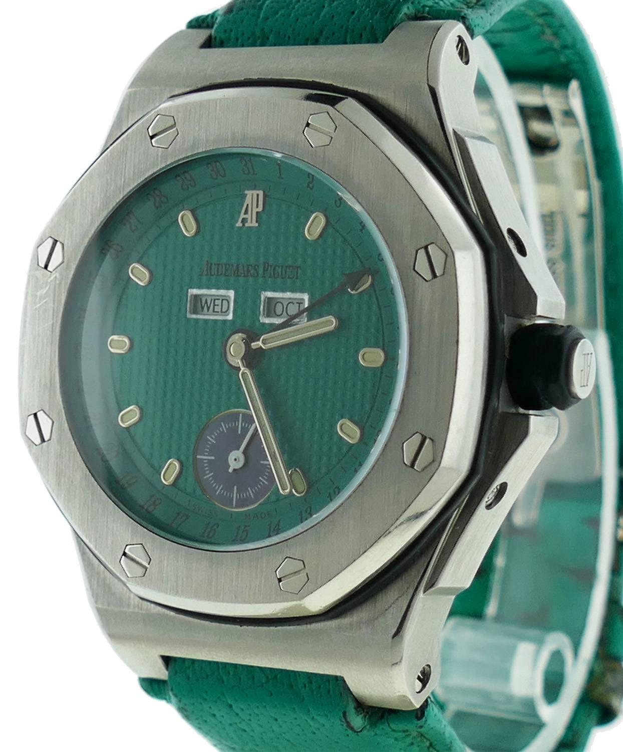 Mens (40mm) Audemars Piguet Royal Oak OffShore Triple Date Green Dial Watch. The Watch is in Good Condition. and Functioning Perfectly; Movement is Powered by Automatic Mechanical Winding. The Watch is on a AP Strap ( Some Wear) & Deployment Buckle.