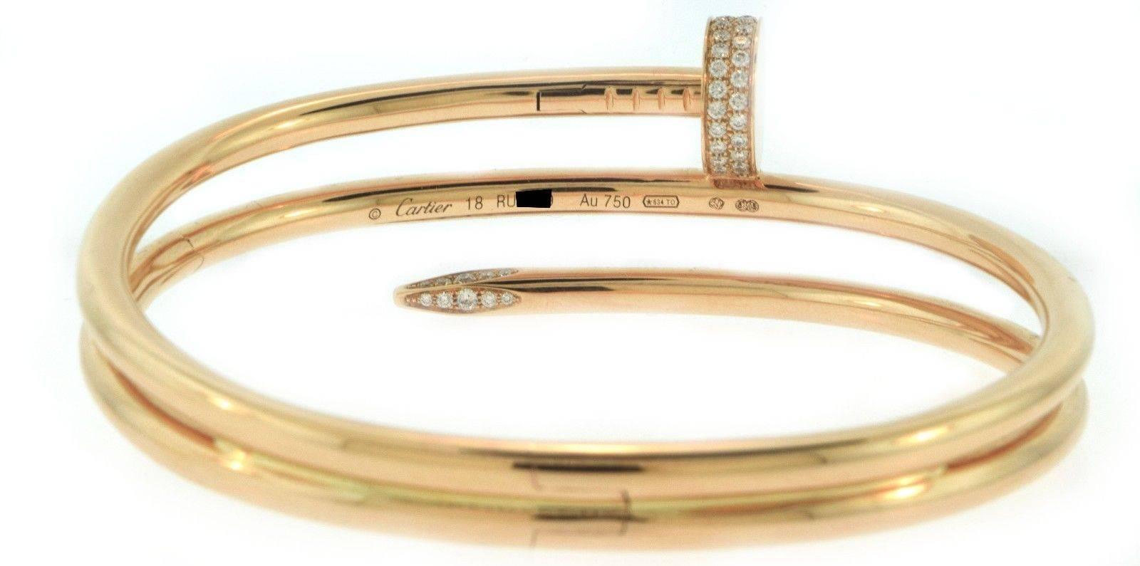 Designer: Cartier
Collection'S: Juste un Clou
Metall: 18k Rose Gold
Edelsteine: 62 Diamanten im Brillant-Schliff mit insgesamt 0,51 Karat
Gewicht: 57,69 Gramm
Breite: 0,860 Zoll
Größe: 18
Punzierung: Cartier 18k, einmalige Seriennummer,
