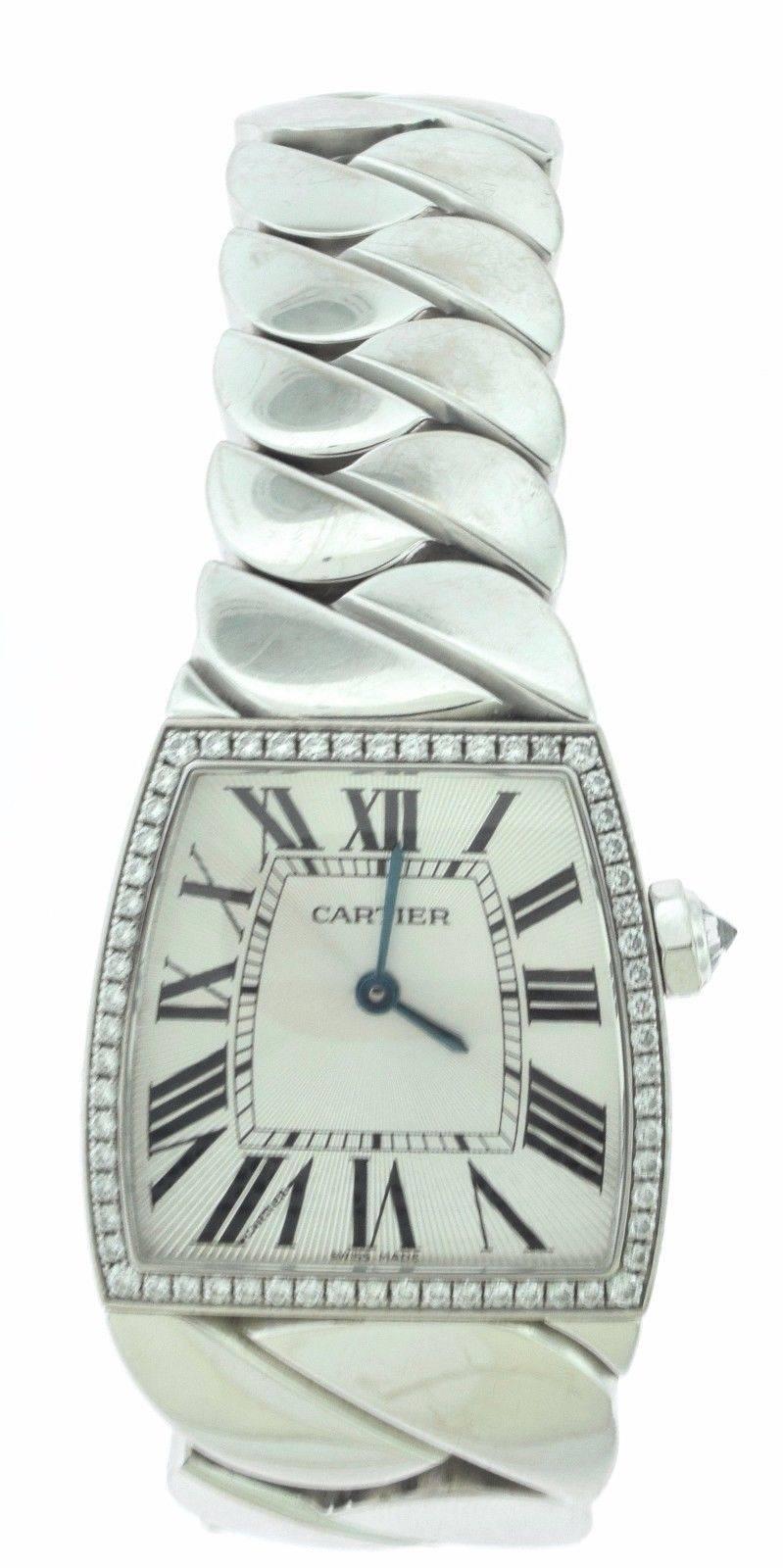 Brand: Cartier
Model: Diamond La Dona
Watch Label: Swiss Made
Movement: Swiss Quartz  Accuracy Mvmnt
Case: White Gold & Diamonds
Dial: Silver Guilloche
Buckle: White Gold Deployment Clasp
Water Resistance: 30 m (3 ATM) / 100 feet
Functions: