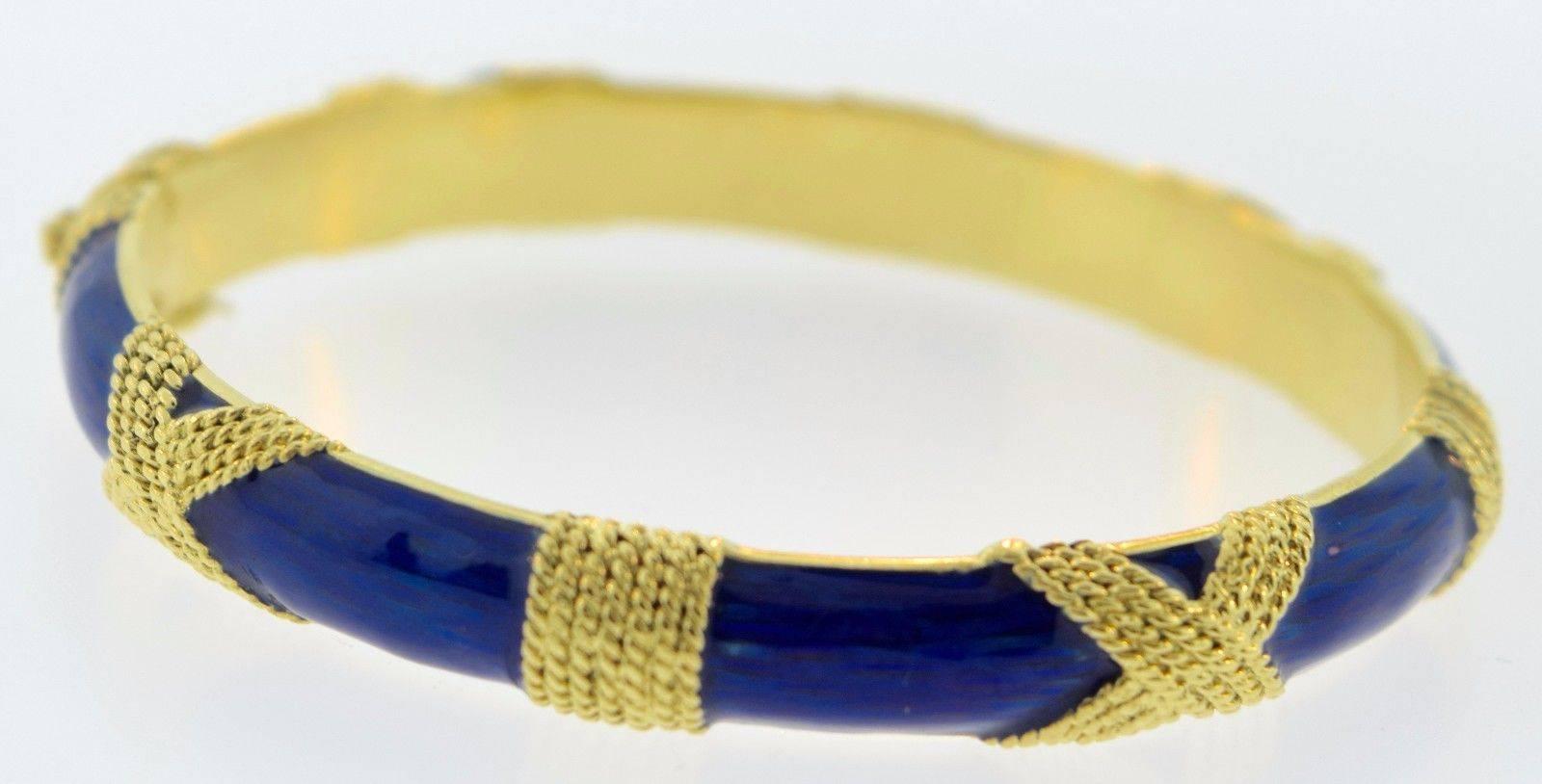 Metal: 18k Yellow Gold
Non-Metal: Blue Enamel
Weight: 37.0 grams
Width: 8.23 mm
Wrist Size: Small-Medium
Hallmark: 18k, ITALY, CARTIER
