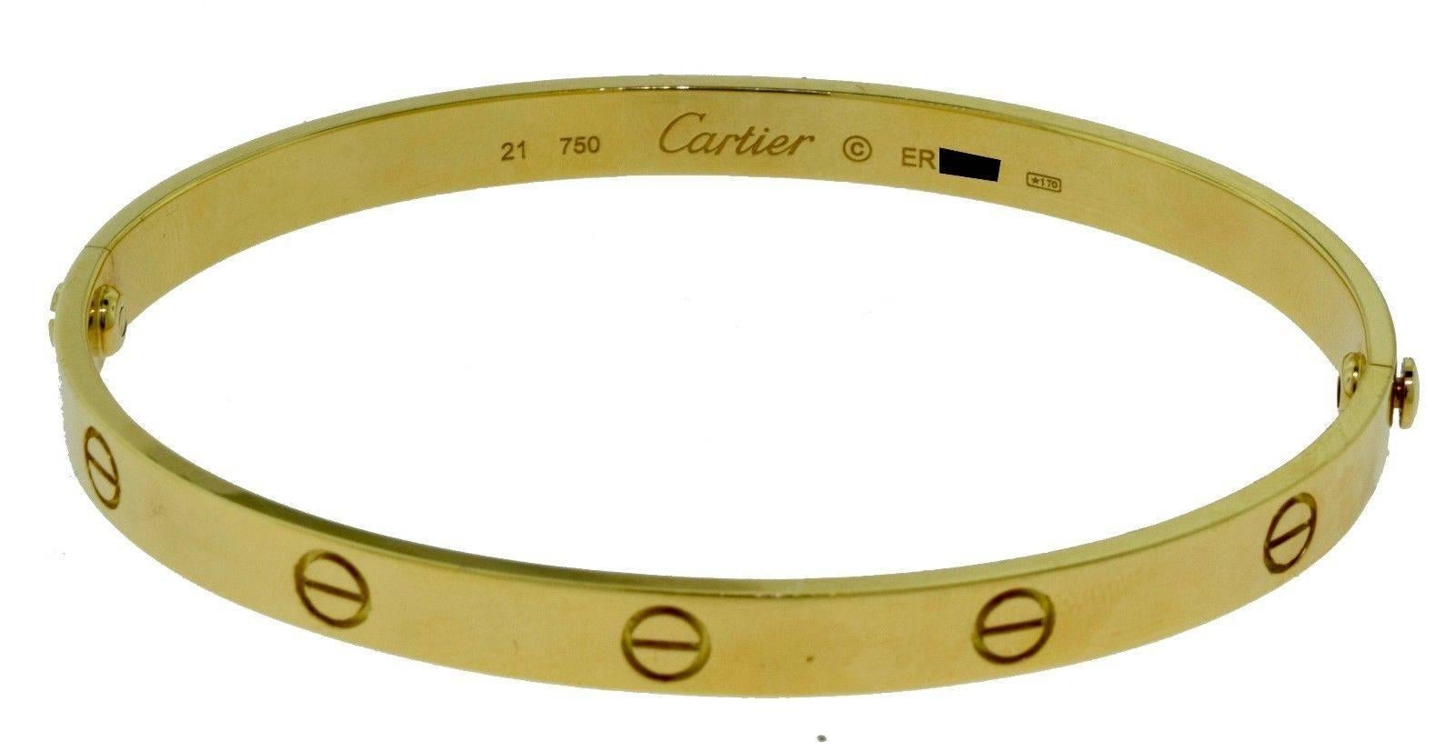 Brand: Cartier
Collection: LOVE
Metal: Yellow Gold
Metal Purity: 18k
Total Item Weight (grams): 37.2
Size: 21
Screw: Old Screw
Hallmark: 21, 750, Serial Number
Signature: Cartier
Includes: Box 