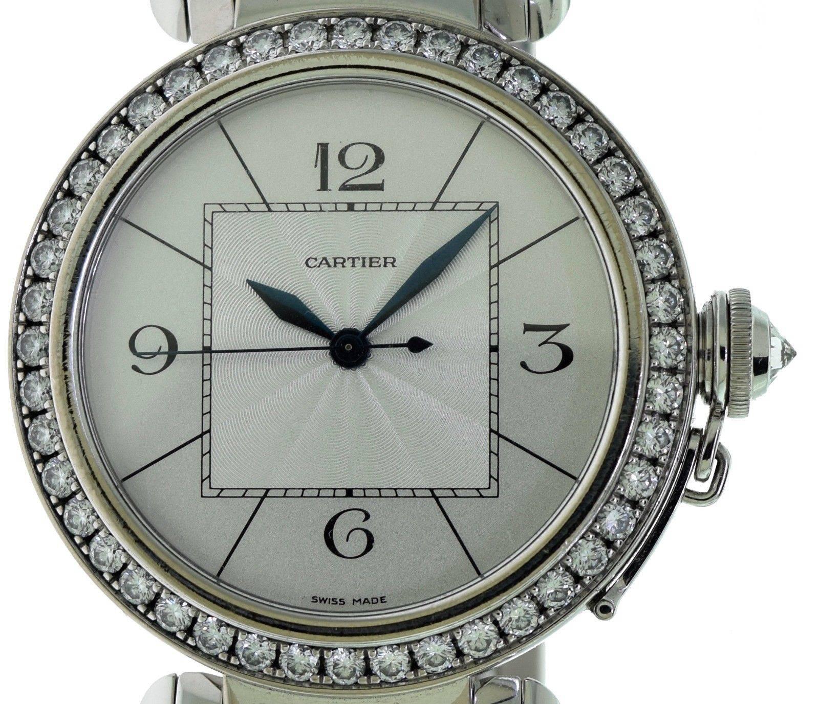 Designer: Cartier
Collection: Pasha
Model: Pasha
Reference: Cartier - 2765
Movement: Automatic
Case Material: White Gold
Shape/Form: Round
Bracelet Material: White Gold
Clasp Type: Folding Clasp

Case Size: 42 mm
Thickness: 8.6 mm
Total
