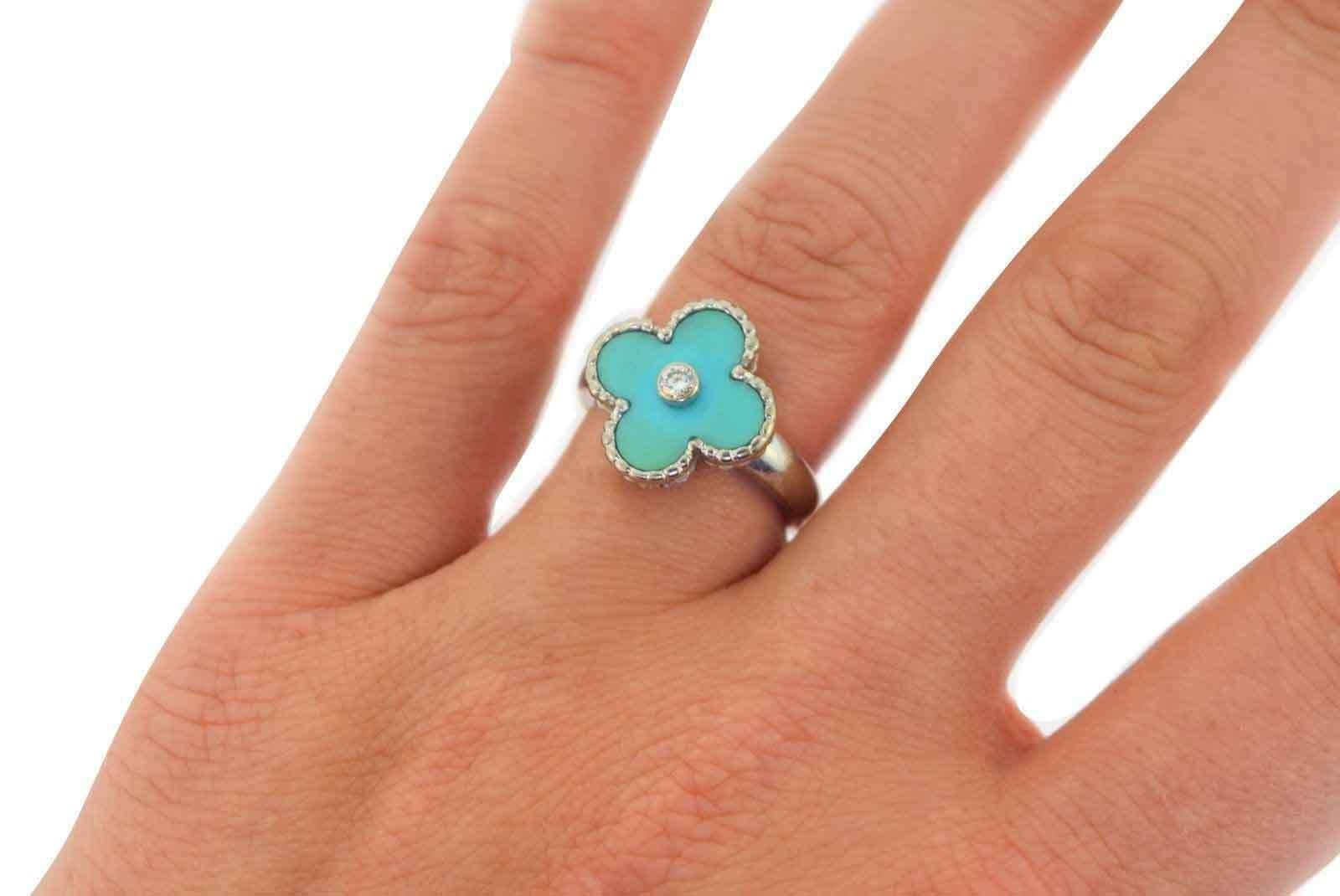 Designer: Van Cleef & Arpels
Collection: Vintage Alhambra
Metal: 18k White Gold
Stone: Turquoise, Diamond
Total Carat Weight: 0.06 ct
Diamond Color / Clarity: F / VVS
Ring Size: 5.25 (US) ; 50 (EURO)
Total Item Weight (grams): 6.5
Motif Dimensions: