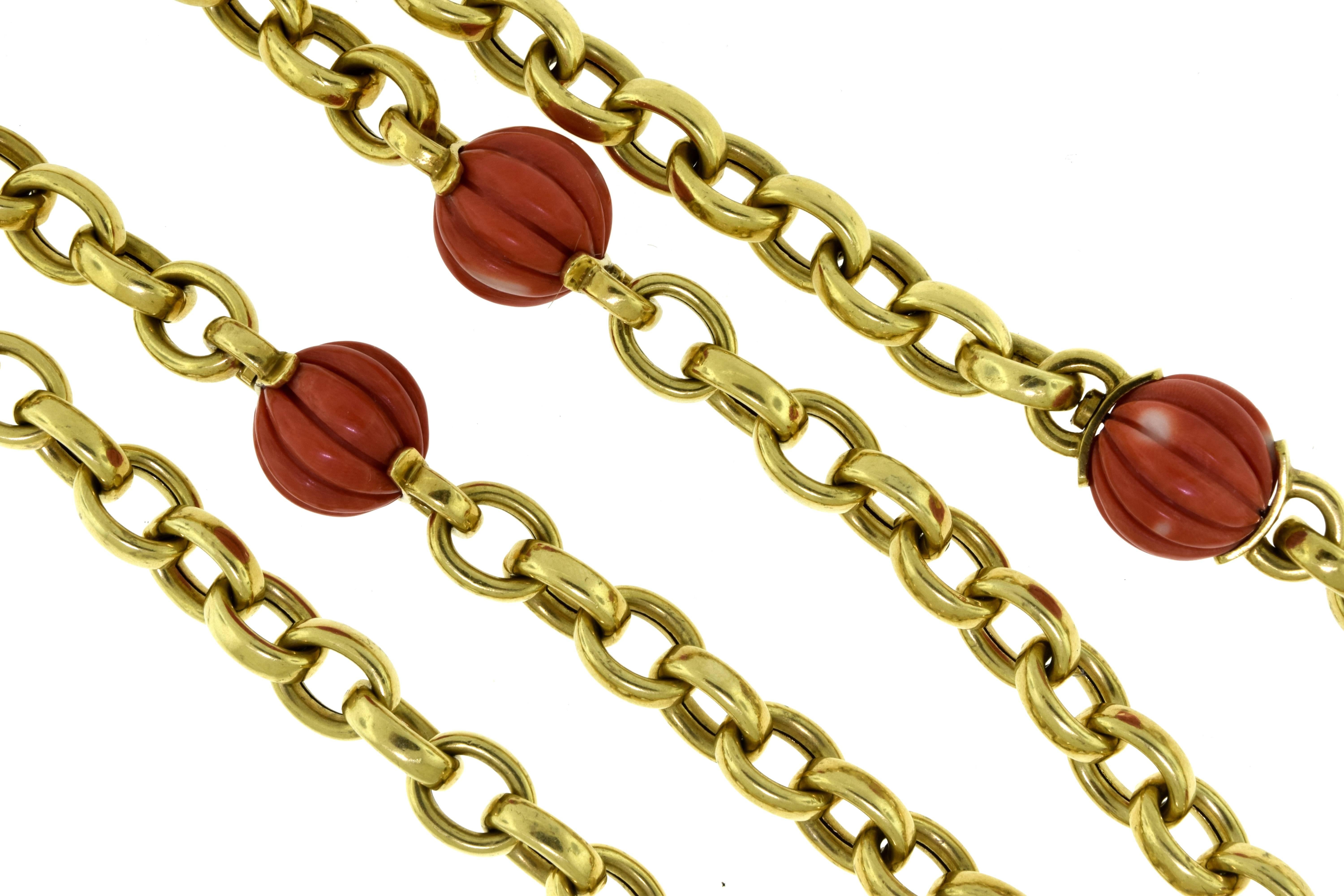 Gorgeous Yellow Gold Ridged Overlap Link Antique Necklace from the 1970's

Metal: 18k Yellow Gold
Stones: Red Coral
Total Item Weight (grams): 126
Total Length: 39 inches
Red Coral Diameter: 19.0 mm (biggest coral) ; 14.7 mm (smallest coral)
