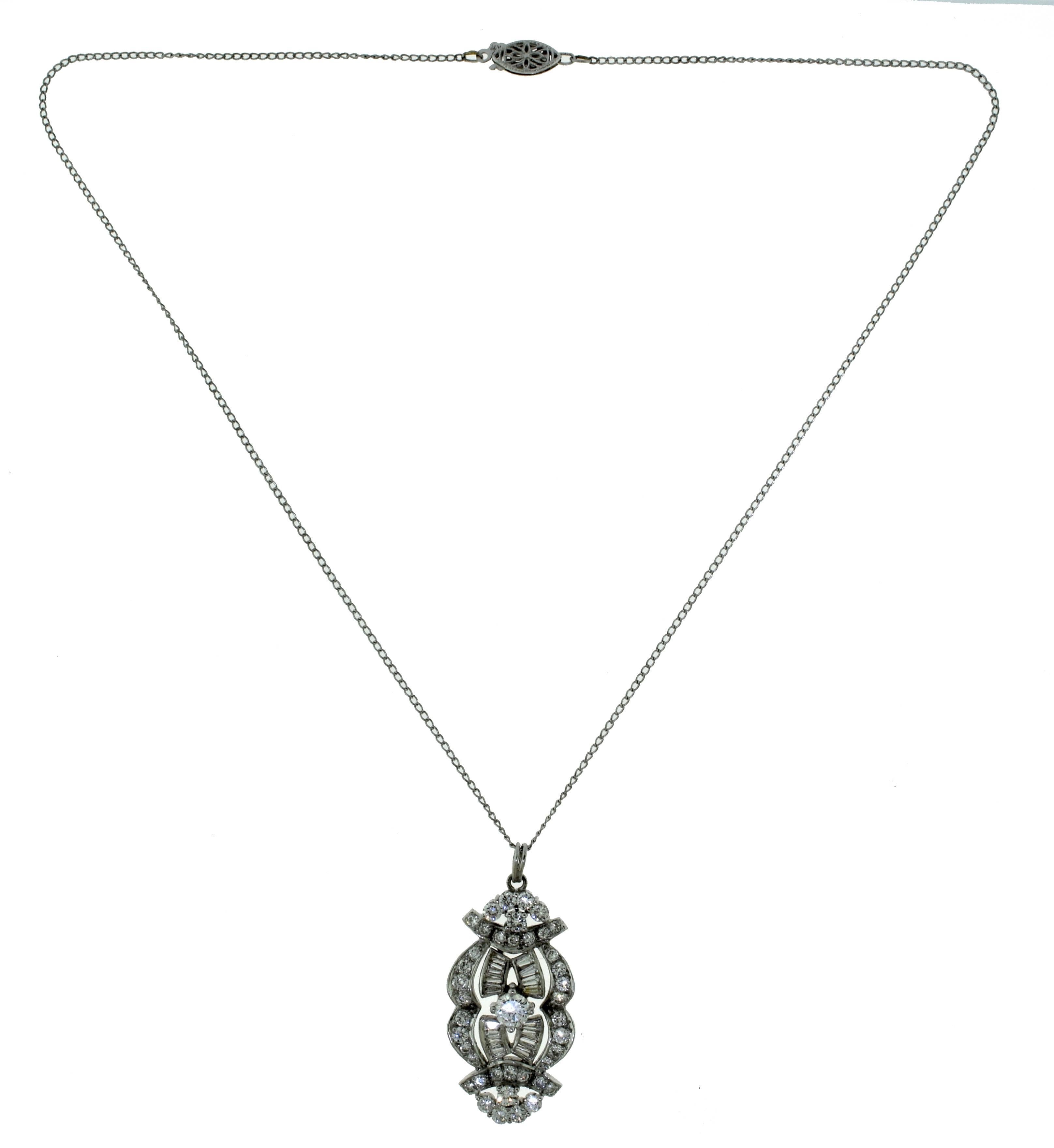 Type: Pendant Necklace
Style: Art Deco
Pendant Metal: Platinum
Chain Metal: 14k White Gold
Chain Length: 16 inches
Stones: Baguette and Round Diamonds
Total Carat Weight: 2.5 carat
Diamond Color: G - H
Diamond Clarity: VS
Total Item Weight (g):
