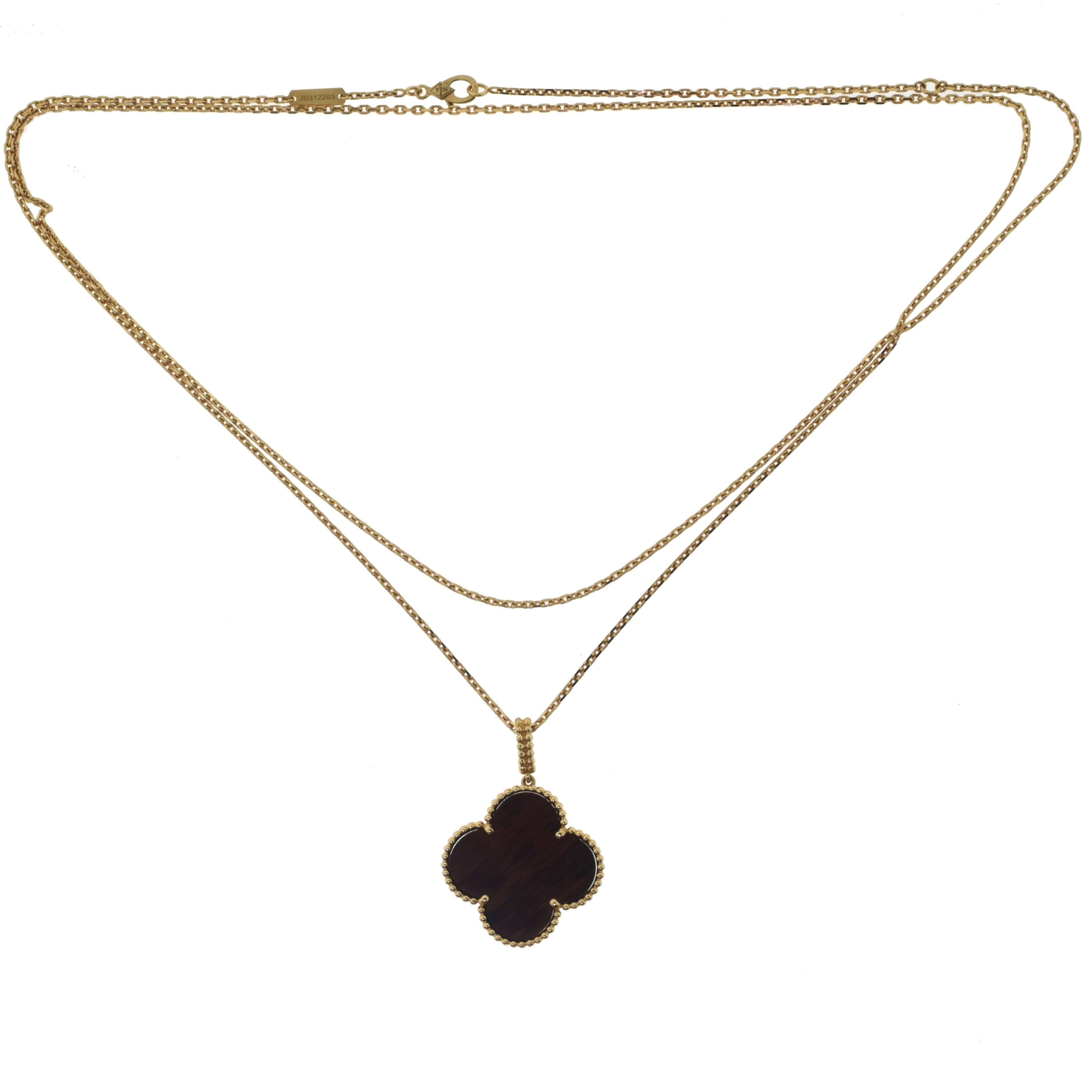 From Van Cleef & Arpel's MAGIC ALHAMBRA Collection:

Type: Long Necklace, 1 Motif
Metal: Pink Gold
Metal Purity: 18k 
Stone: Bois d'Amourette
Chain Length: 30.5 inches (adjustable to 34 inches)
Total Item Weight: 14.4 grams
Motif Dimension: 1