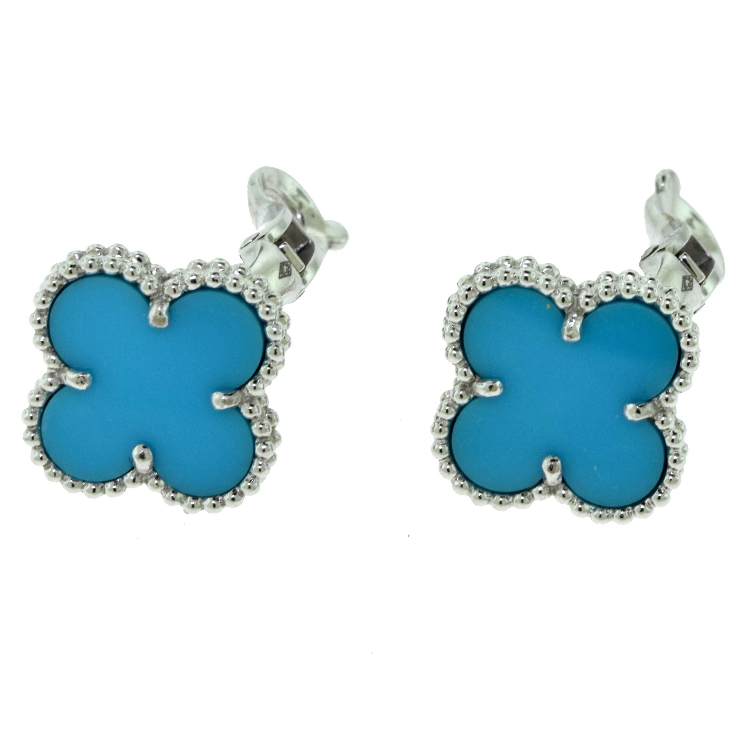 From Van Cleef & Arpel's Vintage Alhambra Collection:

Metal: 18 Karat White gold
Stones: 2 Turquoise Stones
Total Item Weight (g): 7.4
Earring Dimensions (approximate): 14.97 x 12.83mm
Hallmark: VCA Au750 Serial Number
Collateral: Certificate of