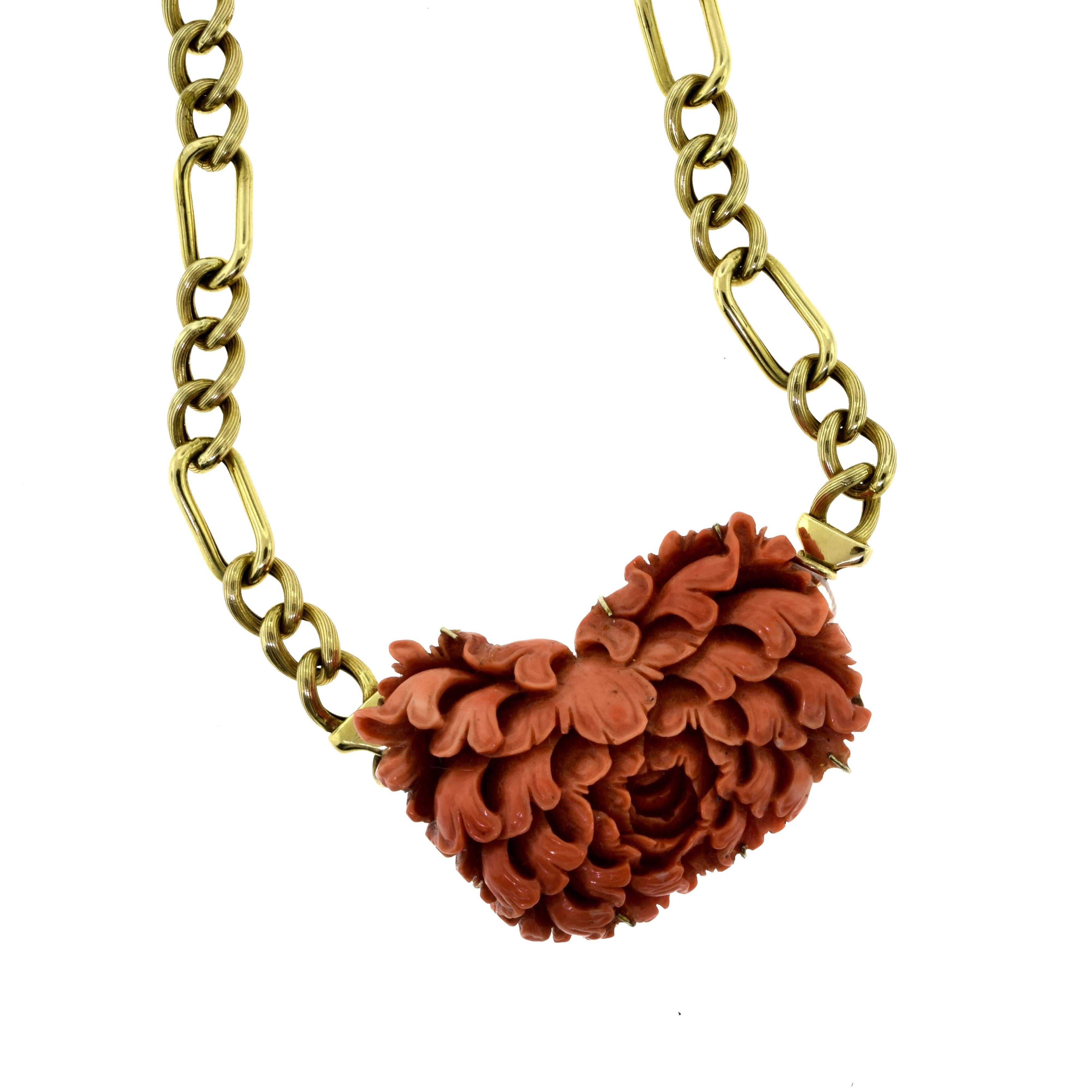Stone: Natural Red Coral 
Coral Dimensions: 1.75 x 1.5 inches
Coral Thickness: approx. 10.11 mm
Metal (chain): 14 Karat Yellow Gold
Chain Type: Figaro Chain
Total Item Weight (g): 45.7

A gorgeous textured natural red coral flower pendant on a 14 k
