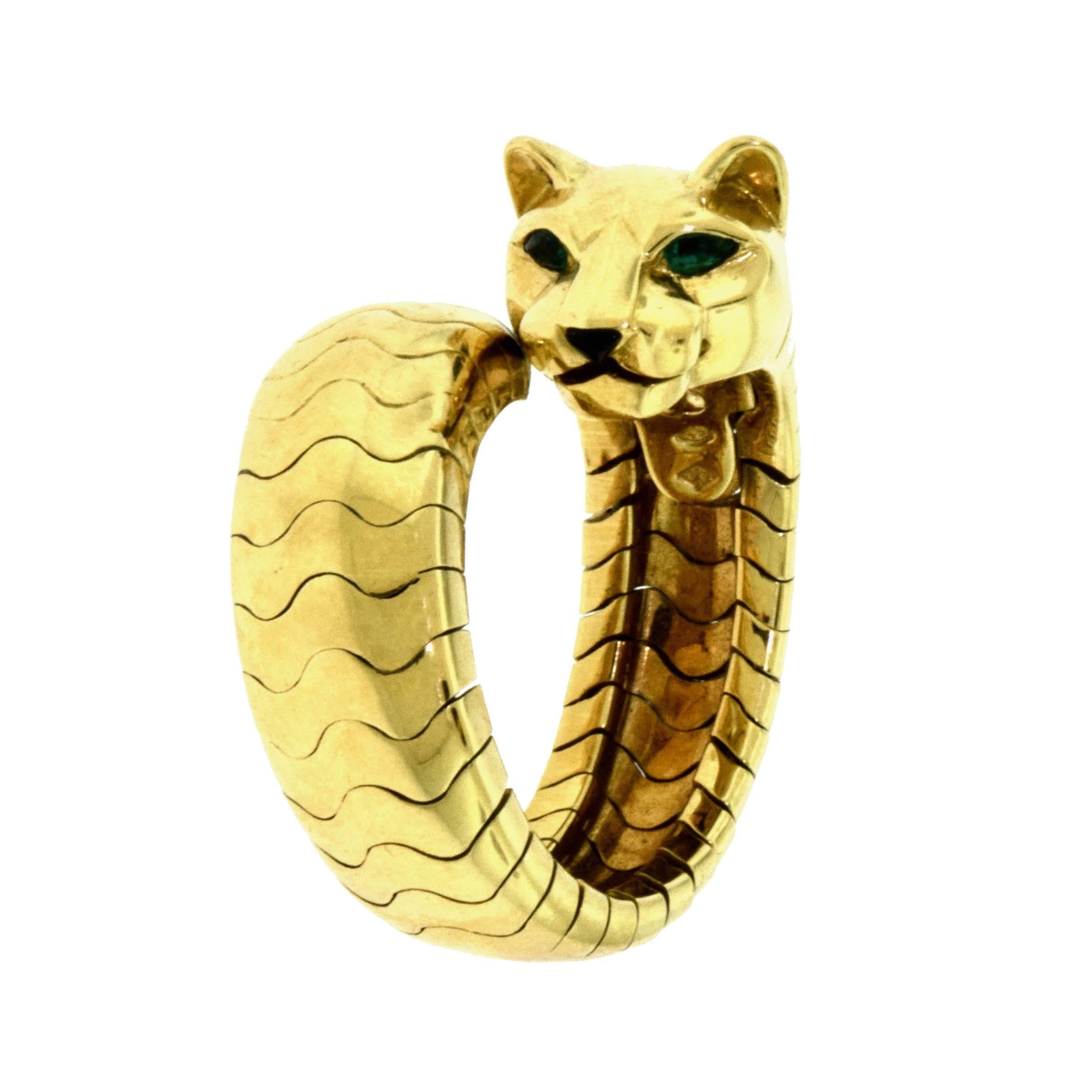 Ring Size: adjustable from 6.5 - 9
Designer: Cartier
Collection: Panthere de Cartier
Metal: Yellow Gold
Metal Purity: 18k
Stones: Tsavorite Garnets, Onyx
Total Item Weight (g): 20.4
Panther Head Width: 10.73 mm
Band Width (at its smallest): 8.48