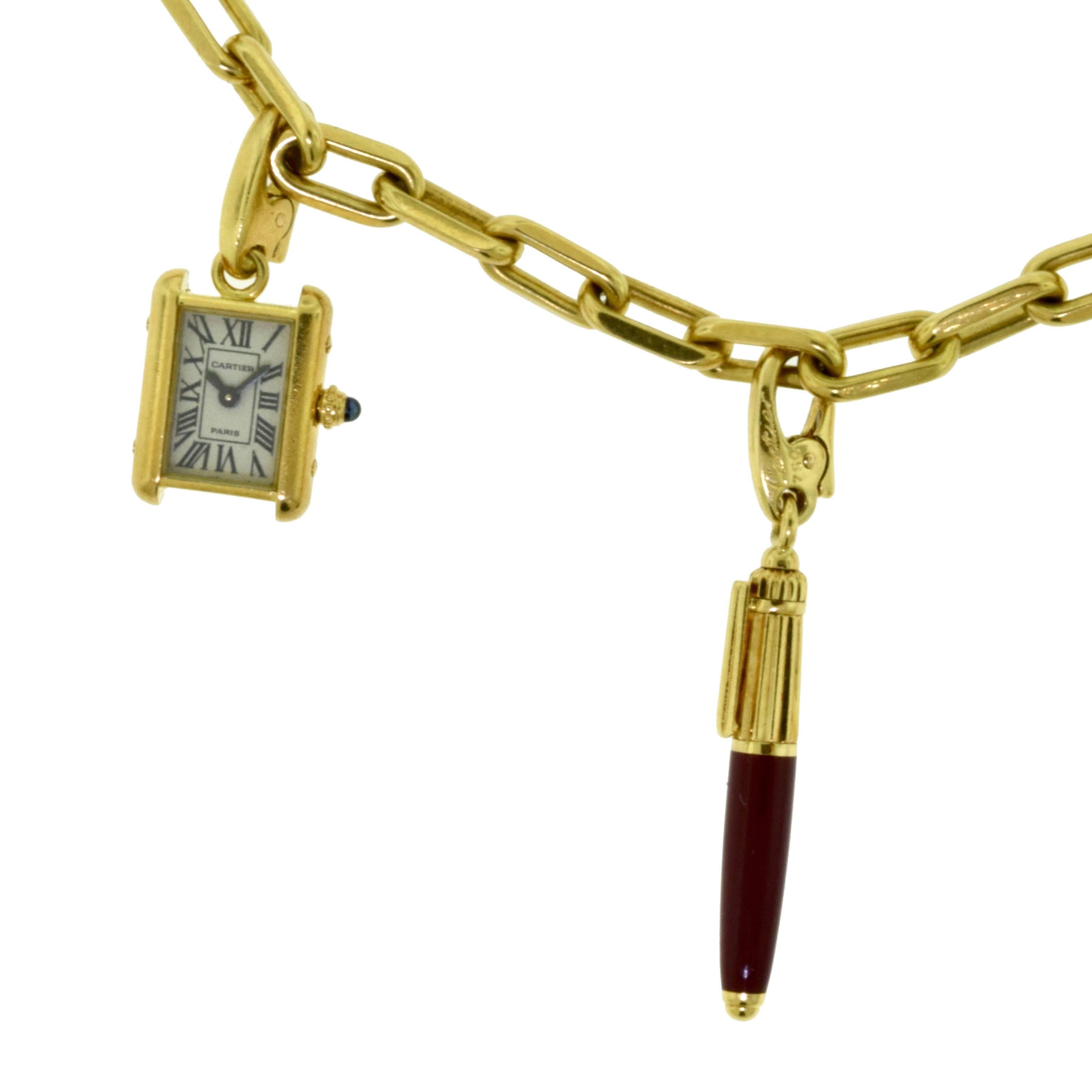 Designer: Cartier​​​​​​​
Type: Charm Necklace​​​​​​​
Metal: Yellow Gold
Metal Purity: 18k 
Charms: Elephant (emerald eye), Cartier Tank Francaise Watch, Burgundy (enamel) Pen, Running Panther, Trinity Ring (Rose, White, Yellow Gold)
Necklace Length: