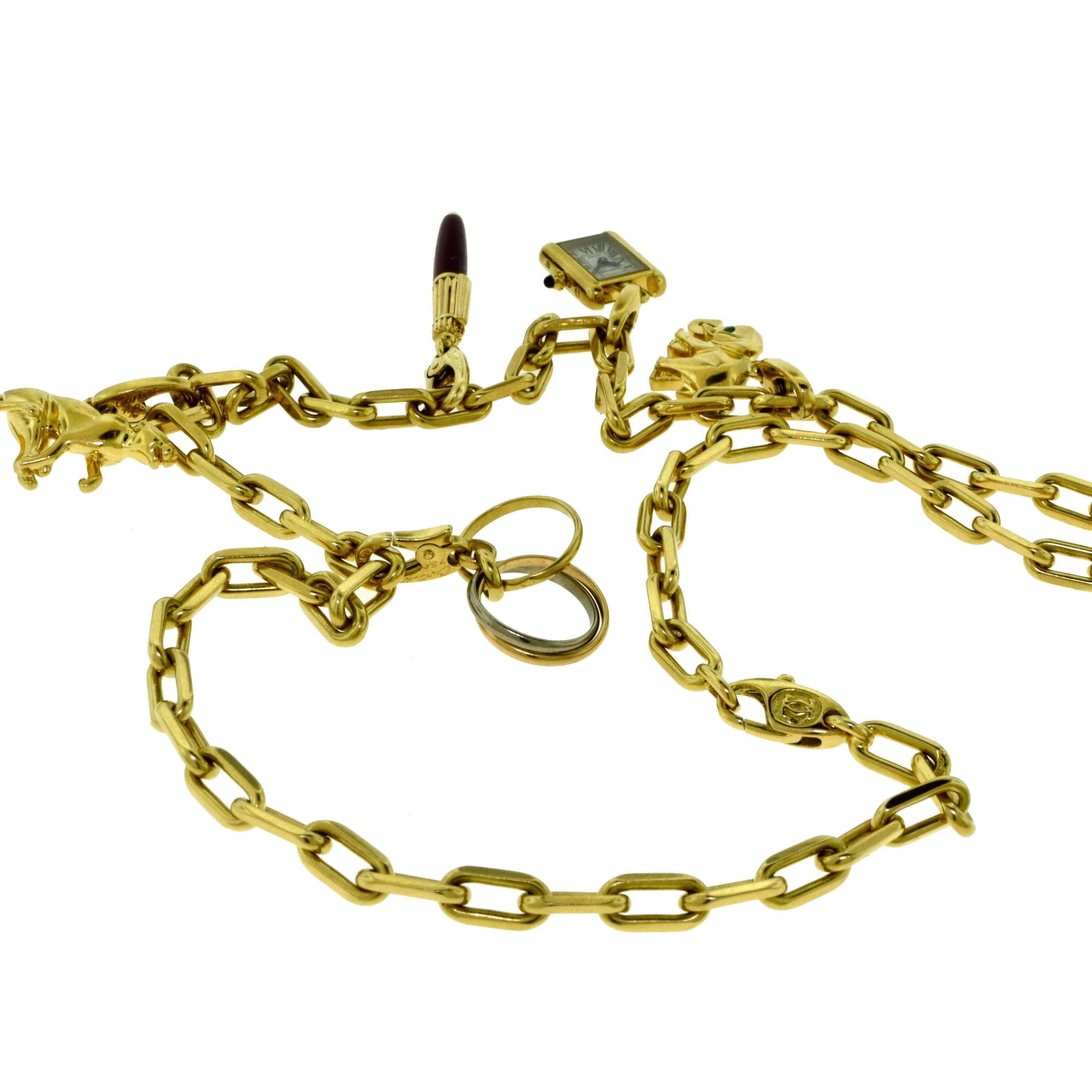 Estate Cartier Yellow Gold Charm Necklace with Cartier Santos Chain In Excellent Condition For Sale In Miami, FL
