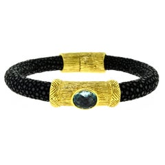 NINI 18 Karat Yellow Gold Black Snake Skin Bracelet with Topaz Oval Stone