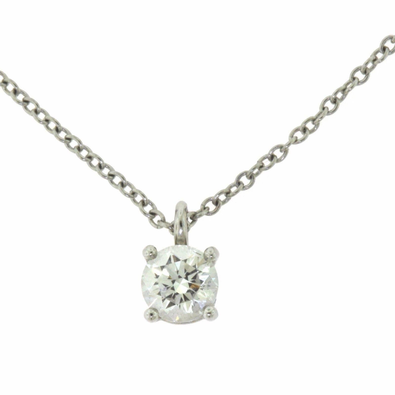 Magnificent everyday pendant by Tiffany & Co. in platinum with a round brilliant diamond.

Designer: Tiffany & Co. 
Collection: Solitaire
Metal: Platinum
Stones: 1 Round Brilliant Cut Diamond
Diamond Color: E
Diamond Clarity: VVS1
Diamond