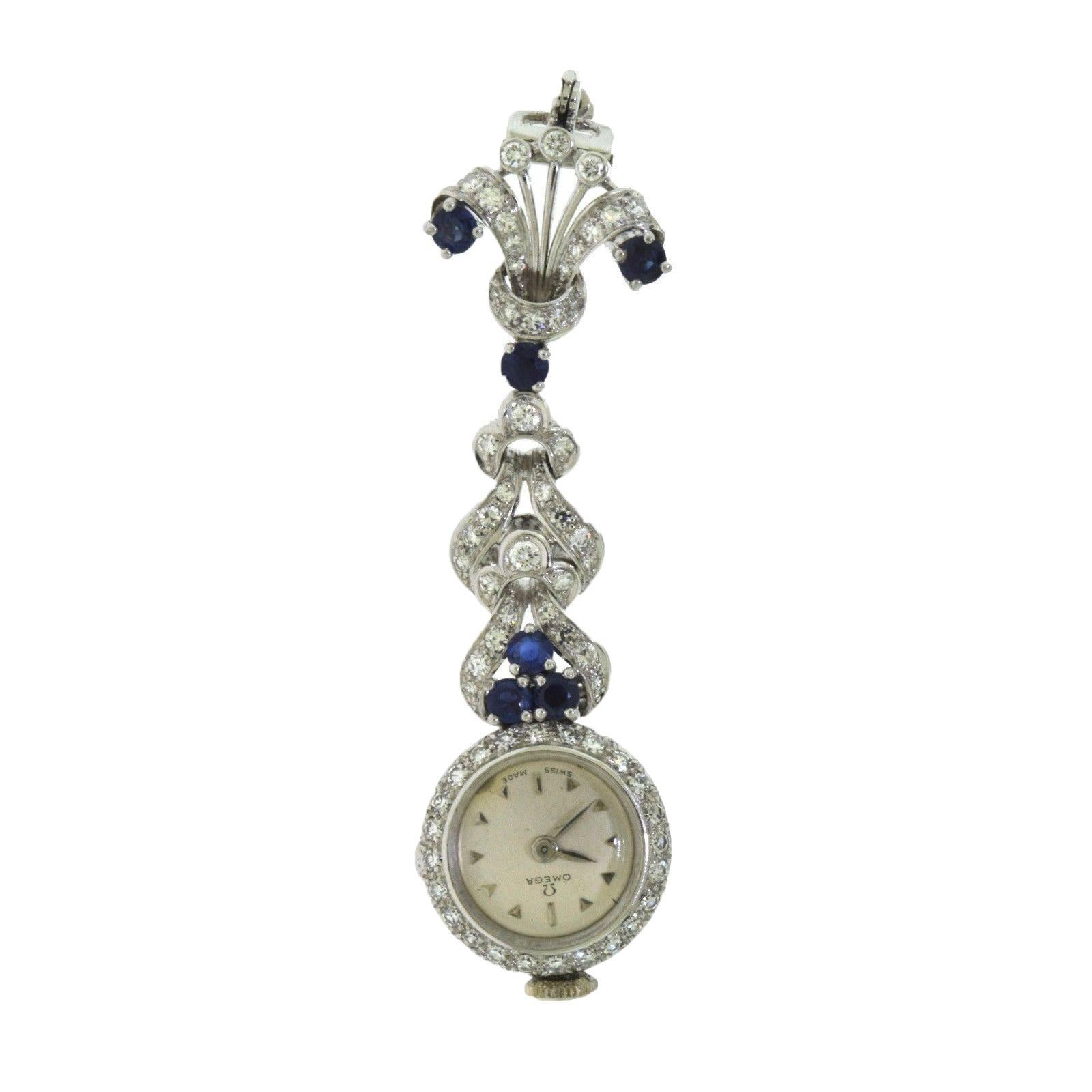 1940s Vintage Omega Diamond and Sapphire White Gold Falling Brooch / Pin / Watch For Sale