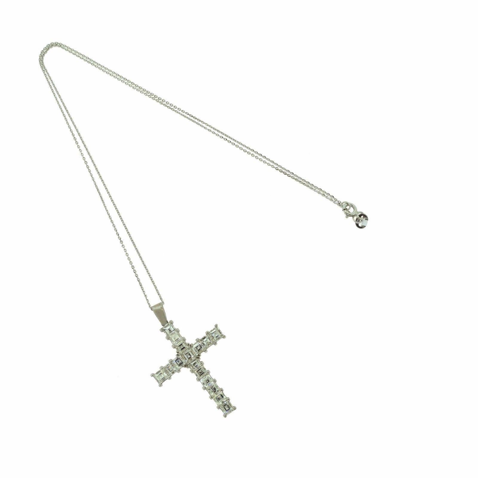 Beautifully crafted, this impressive diamond cross pendant showcases 4.38 carats of Princess diamonds set in a classic 18k white gold design with a versatile chain handcrafted in 14k white gold.

Item Specifications:
Style: Diamond Cross
