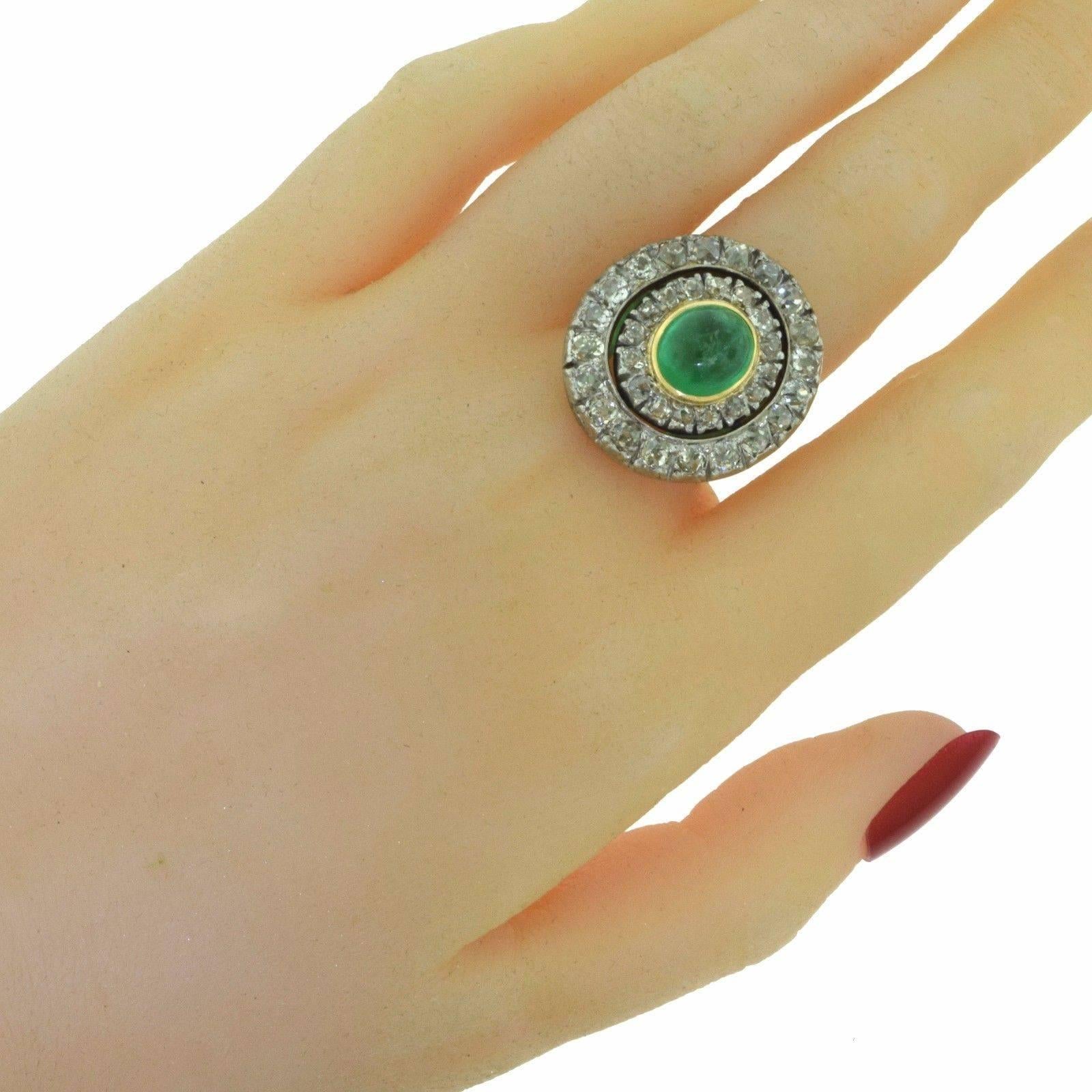 
Metal: 18k Yellow Gold
Metal Purity: 18k

Stones: 
Round Brilliant Cut Diamonds = 4 ct
1 Cabochon Round Emerald = 3.25

Diamond Color: J
Diamond Clarity: VS
Total Carat Weight: 7.25 ct
Ring Diameter: 23.8 mm
Ring Size: 5.5 (sizable) 
Total Item
