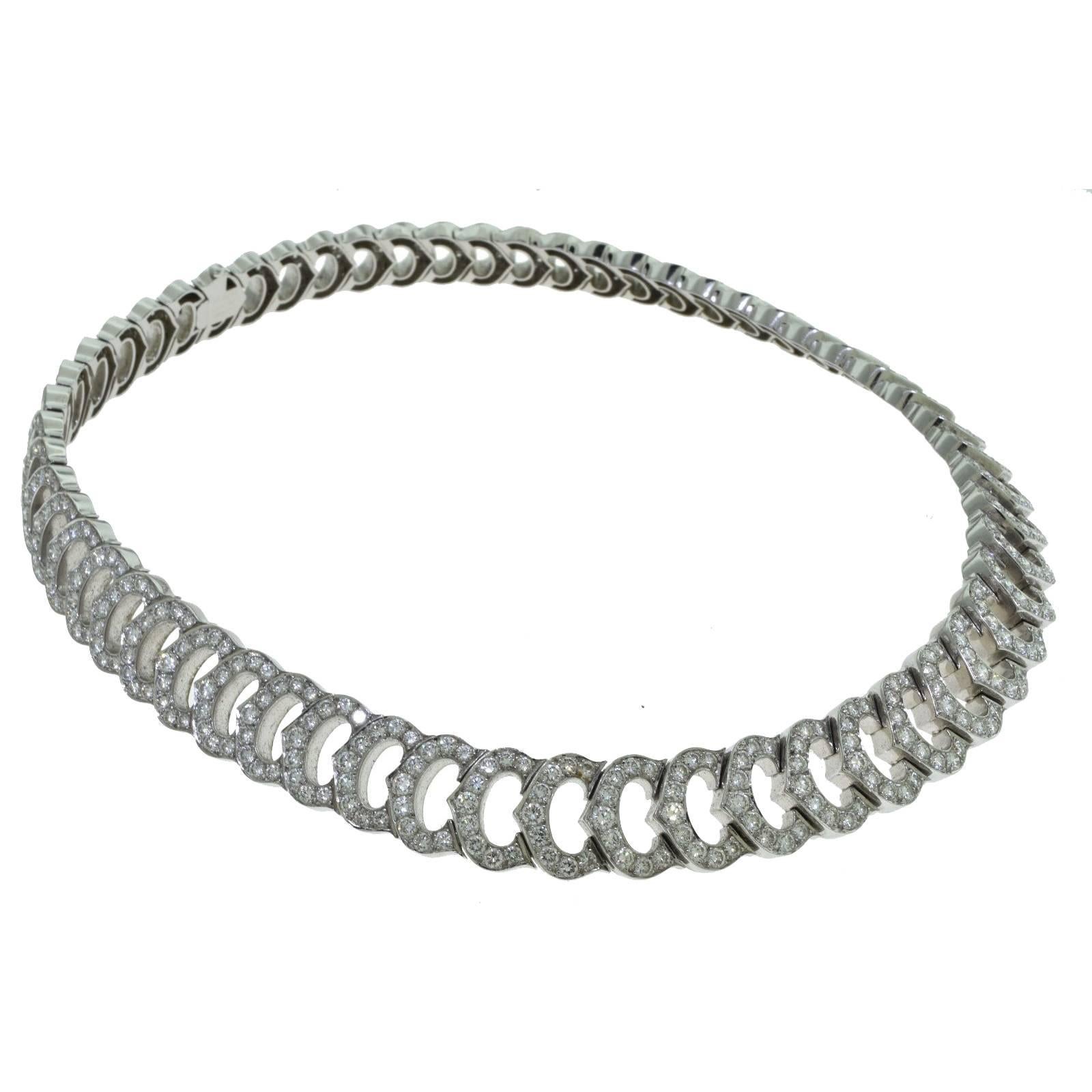 18 Karat White Gold gorgeous necklace by Cartier's C de Cartier Double C Collection with Round Brilliant Cut Diamonds weighing a total of 20 carat. Color E - F and Clarity VVS.

Total Item Weight (g): 112.80
Length: 16 inches
Hallmark: Cartier