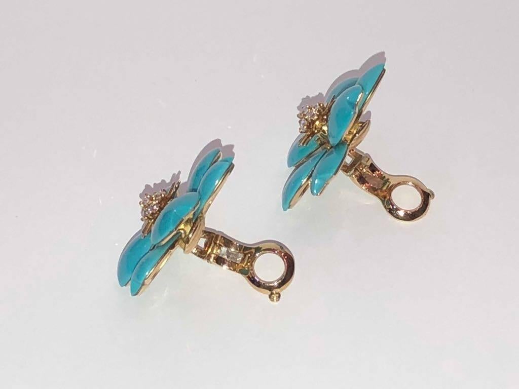 Designer: Van Cleef & Arpels

Collection: Rose de Noel

Style: Vintage

Metal: Yellow Gold

Metal Purity: 18k 

Stones: Round Brilliant Cut Diamonds, Turquoise

Total Item Weight (g): 38

Earring Dimensions: approx 43 mm

Closure: Clip On

Hallmark: