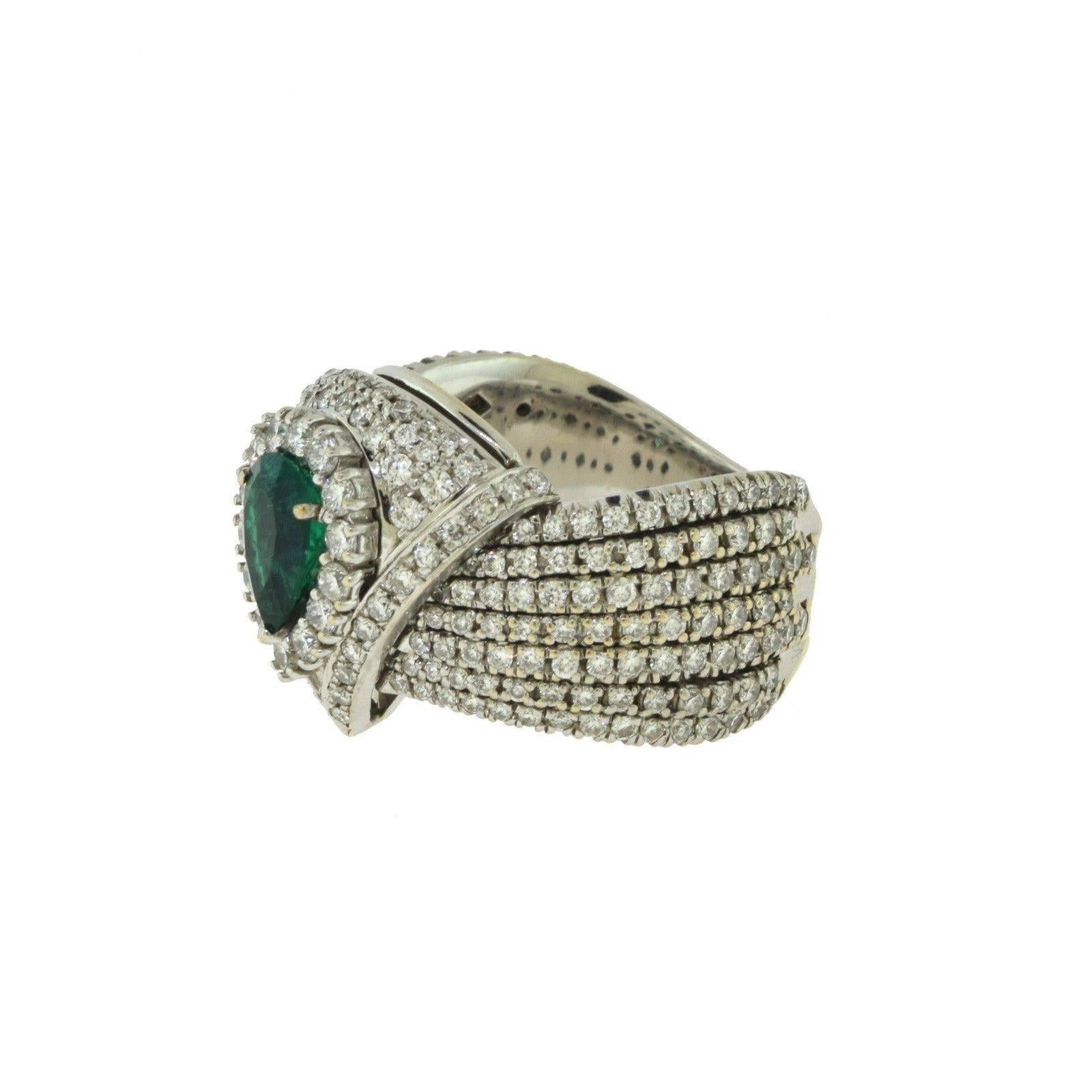 Metal: 18k White Gold
Stones: Round Brilliant Diamonds ; Emeralds
Diamond Weight: 5.5 ct
Diamond Color: F
Diamond Clarity: VVS
Emerald Weight: 3.5 ct
Total Carat Weight: 9.0 ct
Total Item Weight (g): 18.4
Band Width: 11.95 mm tapers to 5.09 mm
Ring