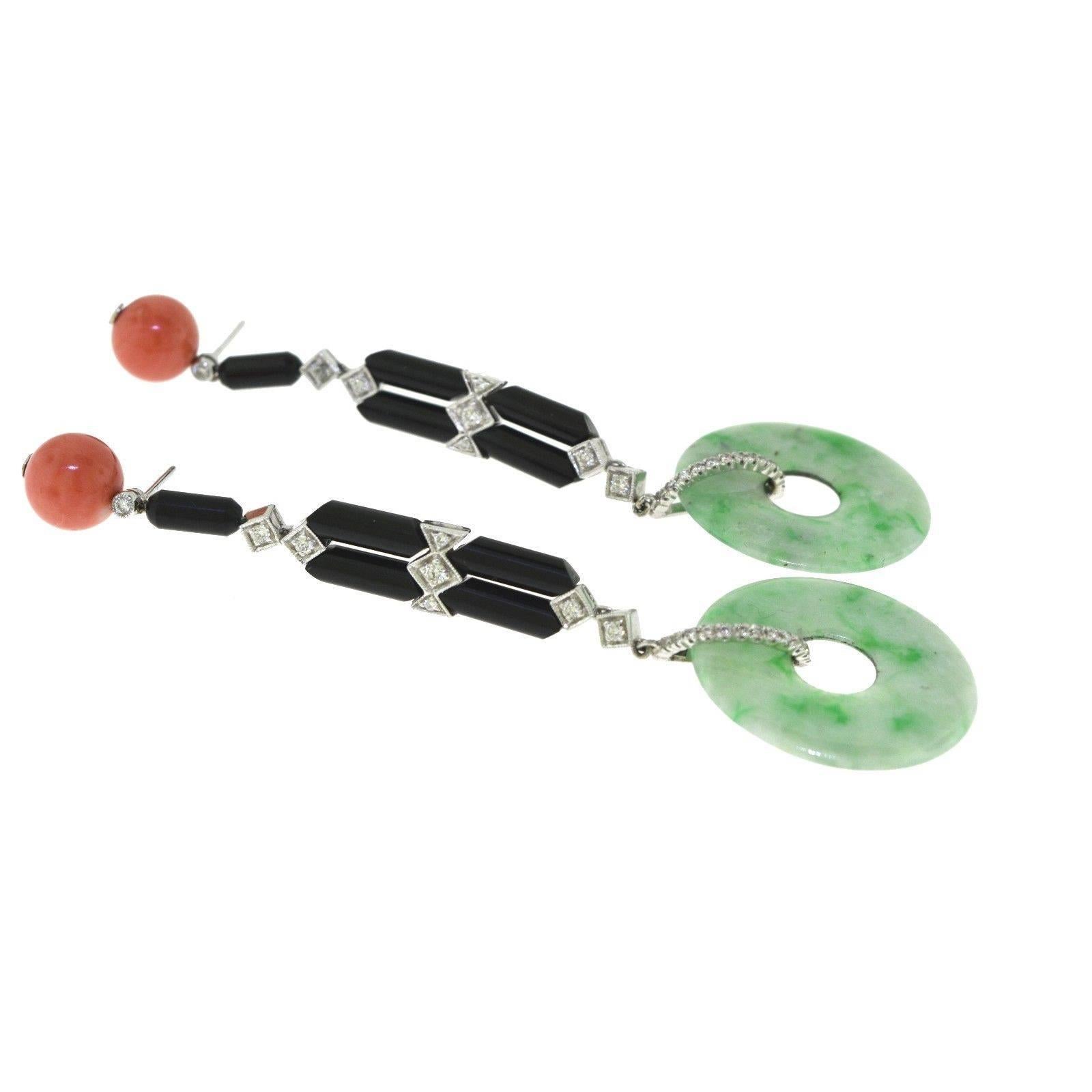 Magnificent and one-of-a-kind, these stunning coral, diamond, onyx, and jade disc drop earrings fall beautifully from your ears. They made the perfect gift for that special someone. Contact us for more information.

Item Specifications:
Metal: White