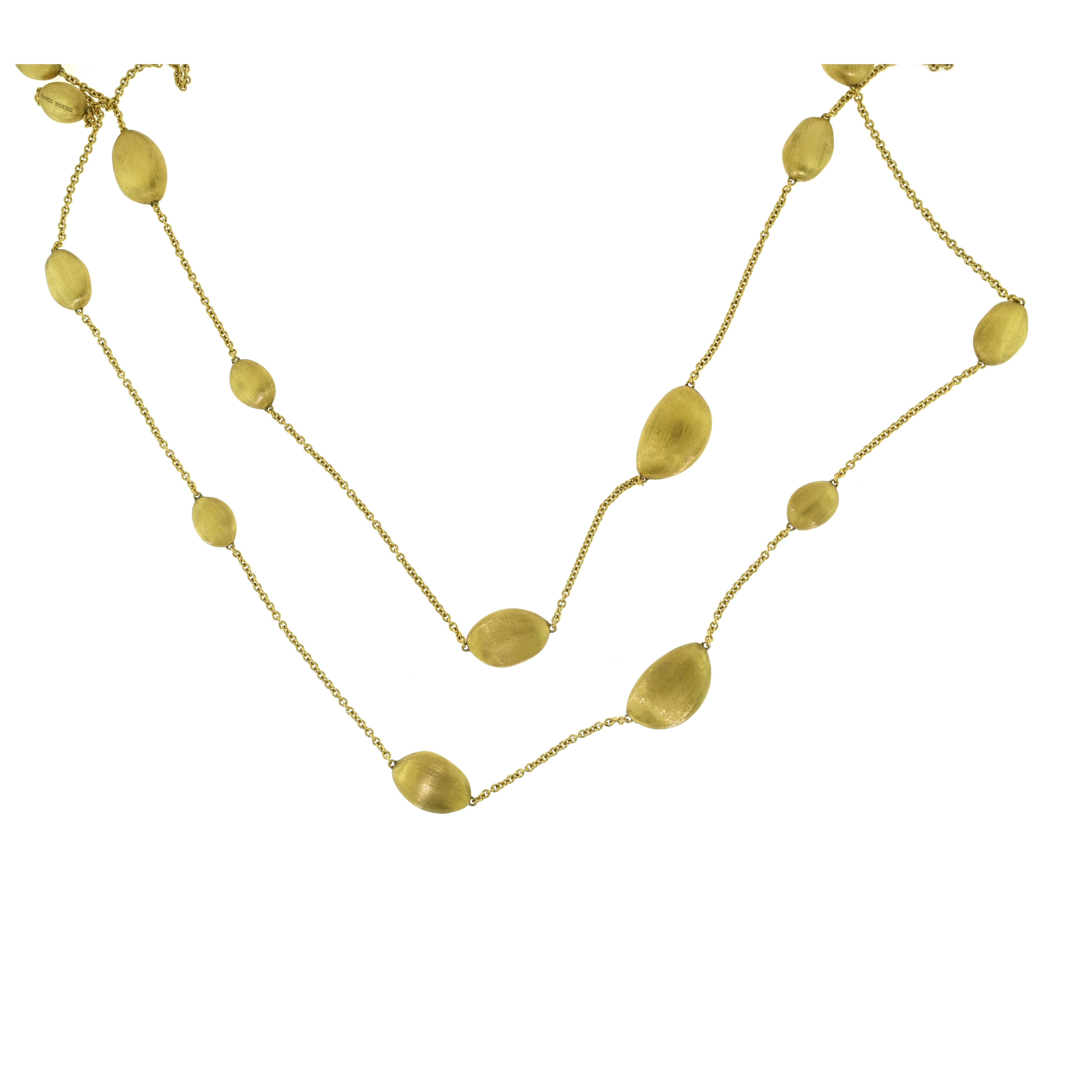 Designer:  Marco Bicego
Collection: Confetti Oro
Style: 14 'bean' necklace
Metal: Yellow Gold
Metal Purity: 18k
Total Item Weight (g): 46.0
Necklace Length: 46 inches
Largest Bean Dimensions: 14.86 x 24.56 x 9.28 mm
Smallest Bean Dimensions: 10.09 x