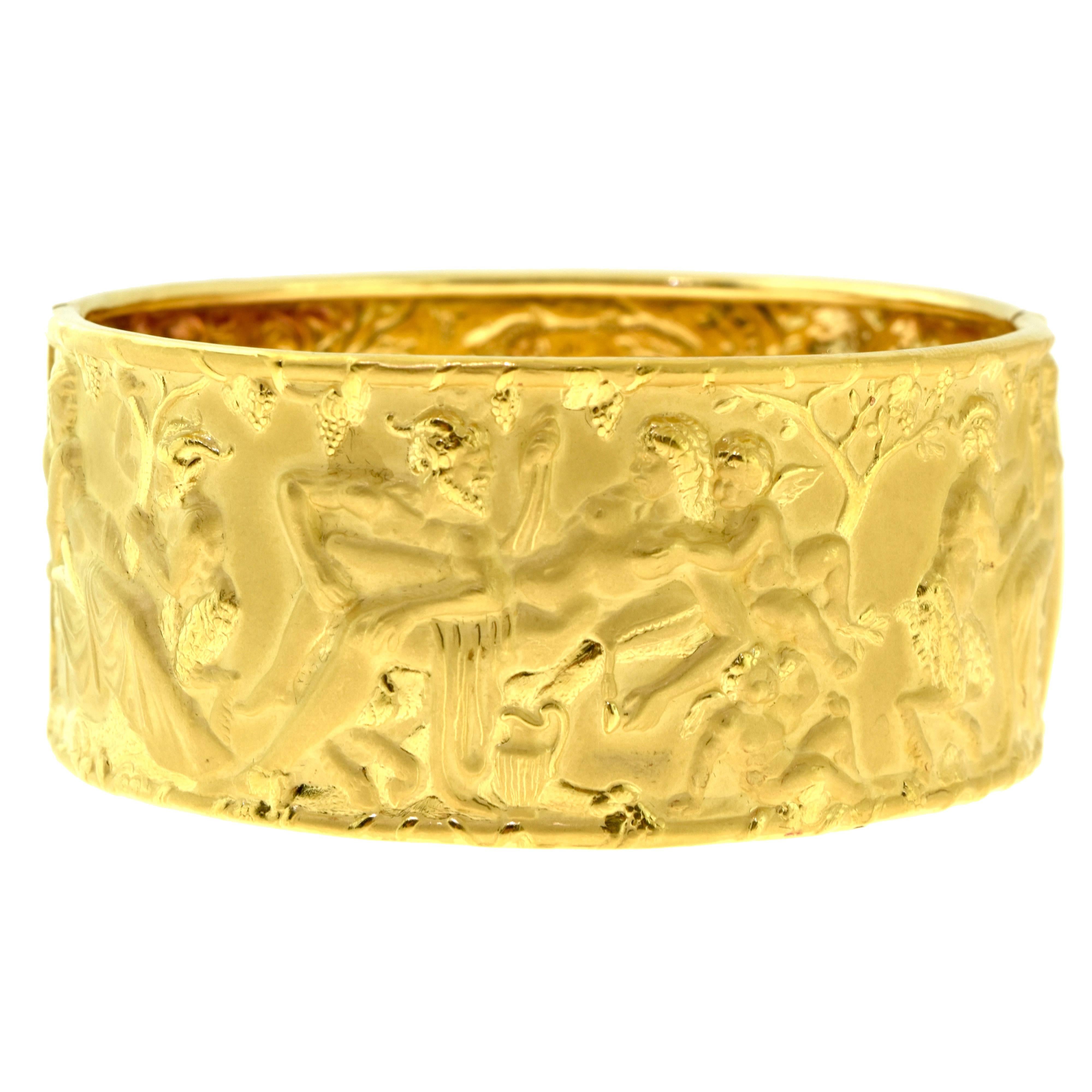 Inspired by Shakespeare's a Midsummer's Night Dream, this erotically infused bangle is absolutely stunning. Set in solid 18k yellow gold, the bangle weighs a total of 52.3 grams and rests beautifully upon your wrist.