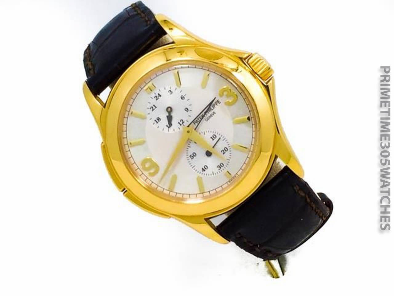 Men's Patek Philippe Travel Time In 18k Yellow Gold w/ Deployment Buckle, Ref 5134J. Watch is Operated by Mechanical Hand Winding. The Watch is In Excellent Condition W/ Some Some Minor Superficial Scratches. Included is a Patek Philippe Box.