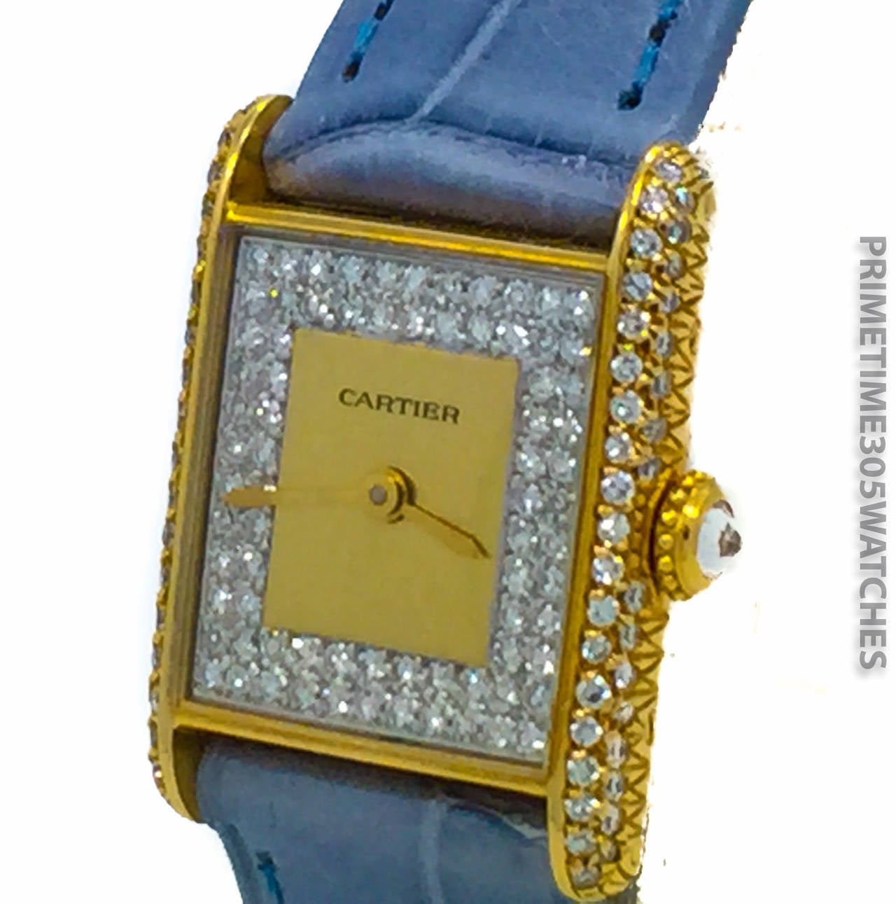 Cartier Ladies (18x25mm) Tank in 18k Yellow Gold W/ Factory Diamond Bezel & Dial. The Watch is on a New Cartier Strap & 18k Plated Cartier Tang Buckle. The Watch Features a Mechanical Hand Winding Movement.