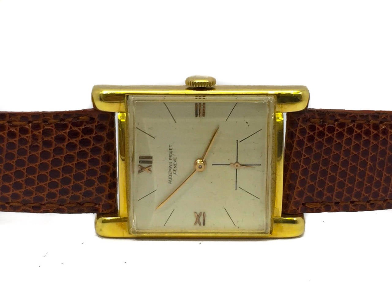 Men's Audemars Piguet Vintage Rectangular watch in 18k Yellow Gold. The Watch is in Great Condition and Keeping Perfect time, Movement is Operated by Mechanical Winding. The Band is Generic & the buckle is as well, though it is stamped 18k.