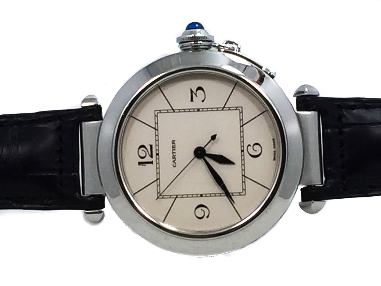Mens Cartier Pasha 42mm Stainless Steel Watch On Leather Strap, Ref W3107255, Retails $7600. The Watch is in Excellent Condition w/ Some Small Scratches on Crystal. The Watch is Functioning Perfectly, it is Powered by Automatic Mechanical Winding.