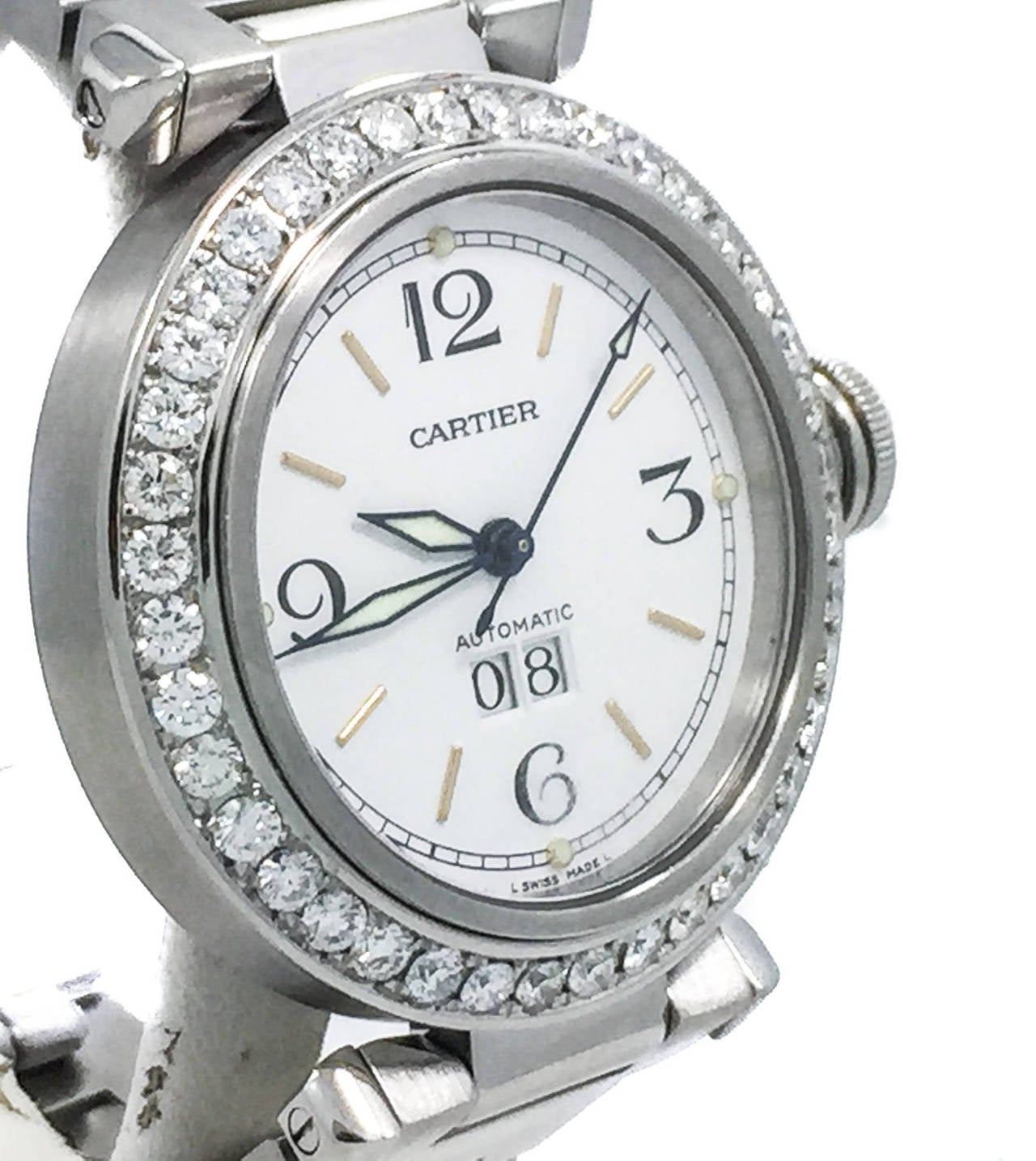 Cartier Ladies 35mm Pasha Big Date in Stainless Steel W/ Very High Quality Diamond Bezel.  The Watch is in Excellent Condition & Keeping Great Time, Movement is Powered by Automatic Mechanical Winding. No Box or Papers. The Watch Bracelet fits up to