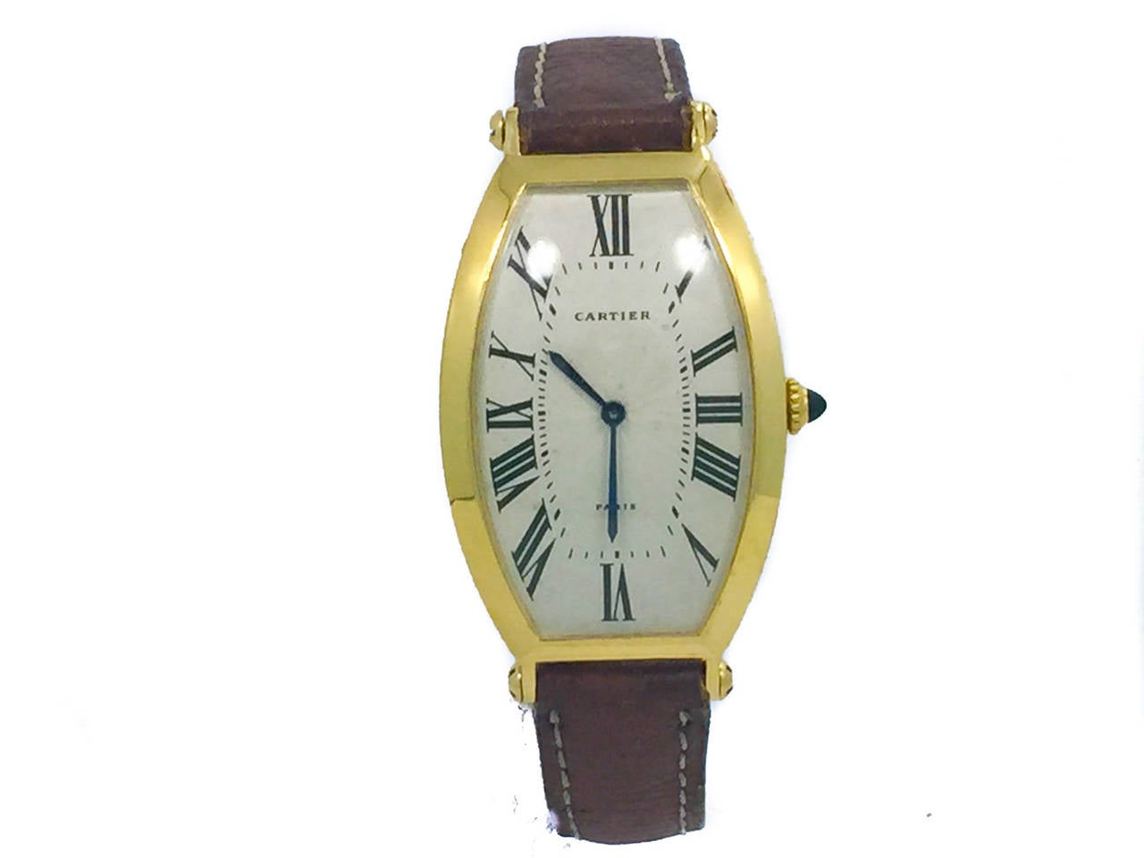 Mens (26x40mm) Cartier Tonneau in 18k Yellow Gold. The Watch is in Great Condition though there are some little spots on the dial (look at pics). The Watch is Powered by Manual Mechanical Winding. The Watch is on a Cartier Strap & Cartier Plated