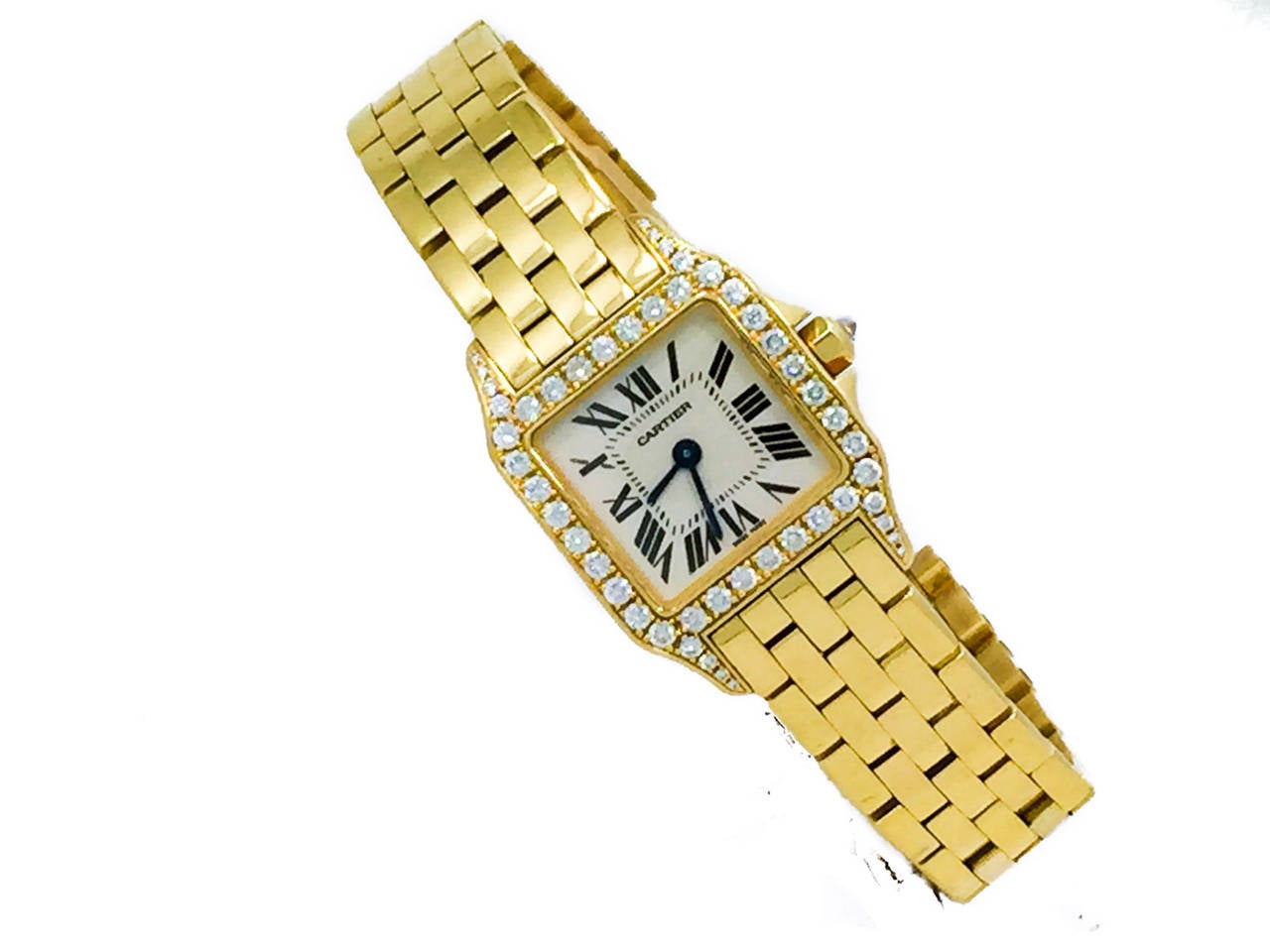 Cartier Ladies (21.5mm) Demoiselle in 18k Yellow Gold W/ Factory Diamond Bezel, Ref WF9001Y7, Retails $27,300. The Watch is in Excellent Condition & Keeping Perfect Time, Movement is Battery Operated. Included With the Watch are Its, Box, Manual,