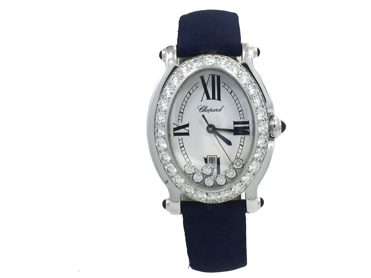Ladies (30x35mm) Chopard Oval Shaped Happy Sport Watch in 18k White Gold W/ Diamond Bezel (2.24ct) & 7 Floating Diamonds (.39ct), Ref 27/7000-23/11 and it Retails $29,000 +. The Watch is in Excellent Condition and Keeping Perfect Time. Movement is