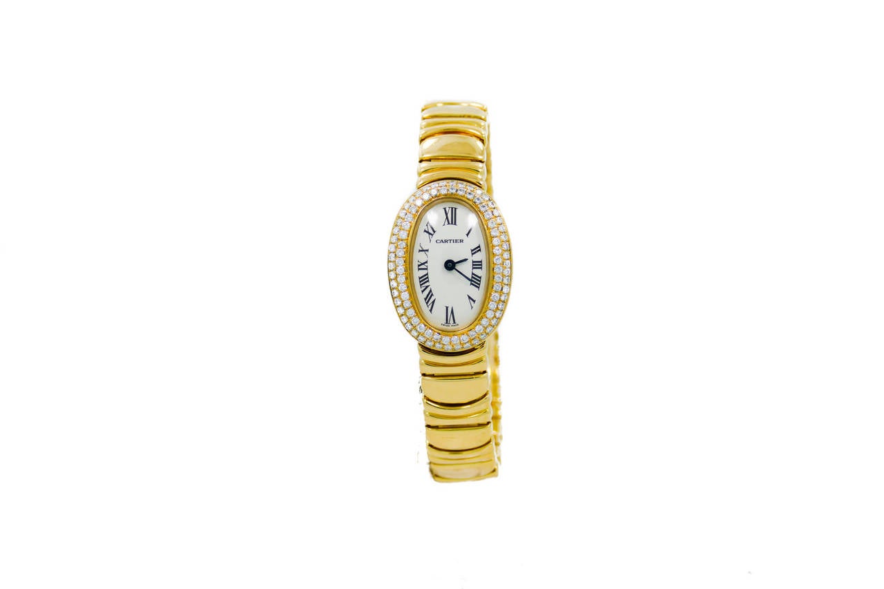 Ladies Cartier Baignoire Mini (18x23mm) in 18k Yellow Gold W/ Factory Diamond Bezel on Bracelet. The Watch is in Excellent Condition & Keeping Perfect Time, Movement is Battery Operated and the Time Is set From the back of the Watch. The Watch