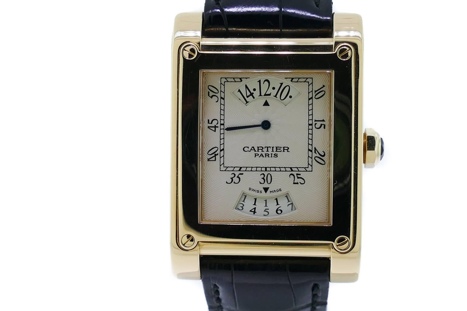 Mens (28x40mm) Cartier Tank A Vis Jumping Hour Paris Privee Yellow Gold Watch Ref W1534451. The Watch is in Excellent Condition and Working Great, Movement is Operated by Mechanical Winding. Included With the Watch is a Cartier Box, Manual &