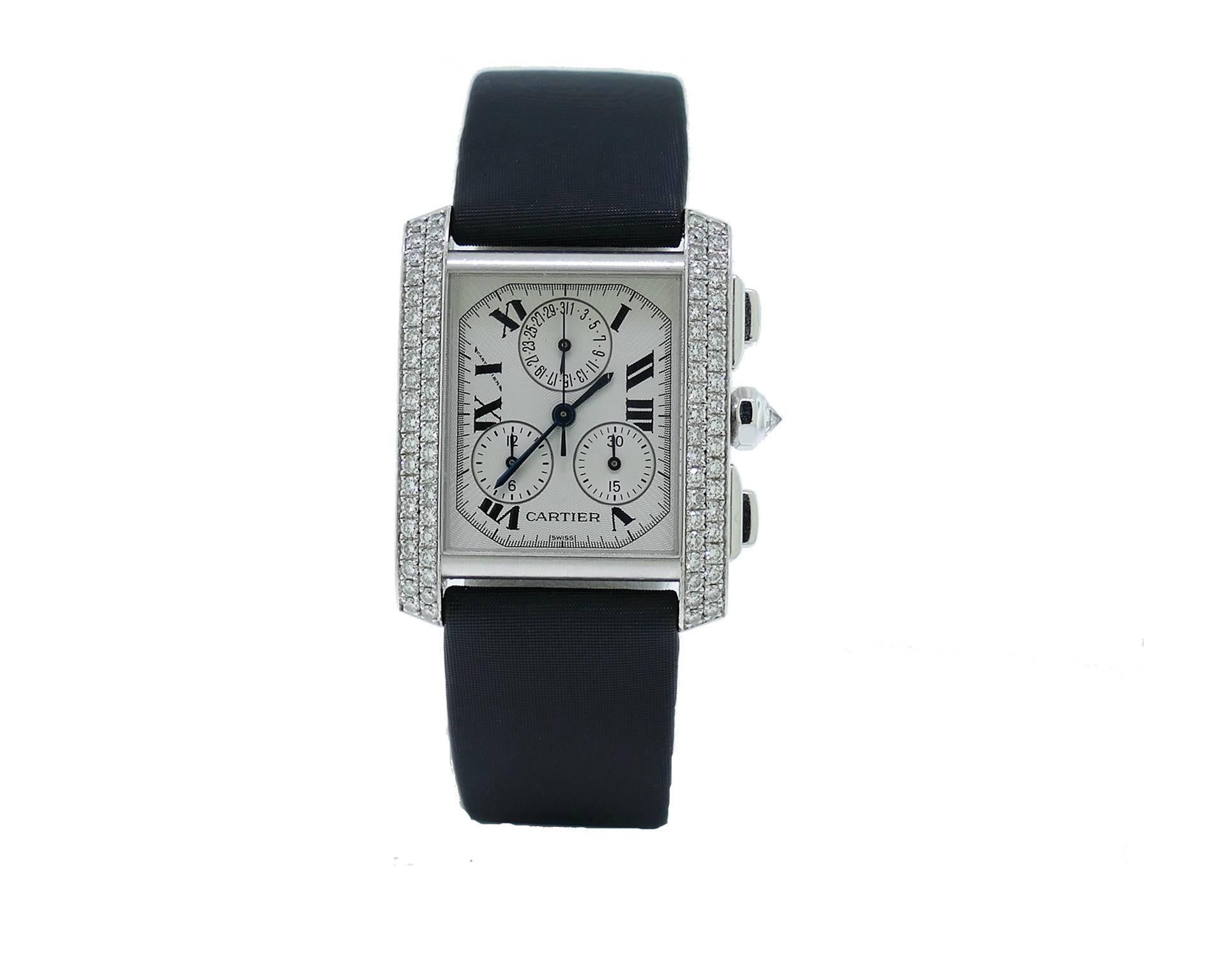 Cartier Tank Francaise Chronograph in 18k White Gold W/ Factory Set Diamond Bezel. The Watch Measures 28x36mm. The Watch is in Excellent Condition & Working Perfectly, Movement is Operated by Battery. The Watch is on a Cartier Satin Strap & 18k