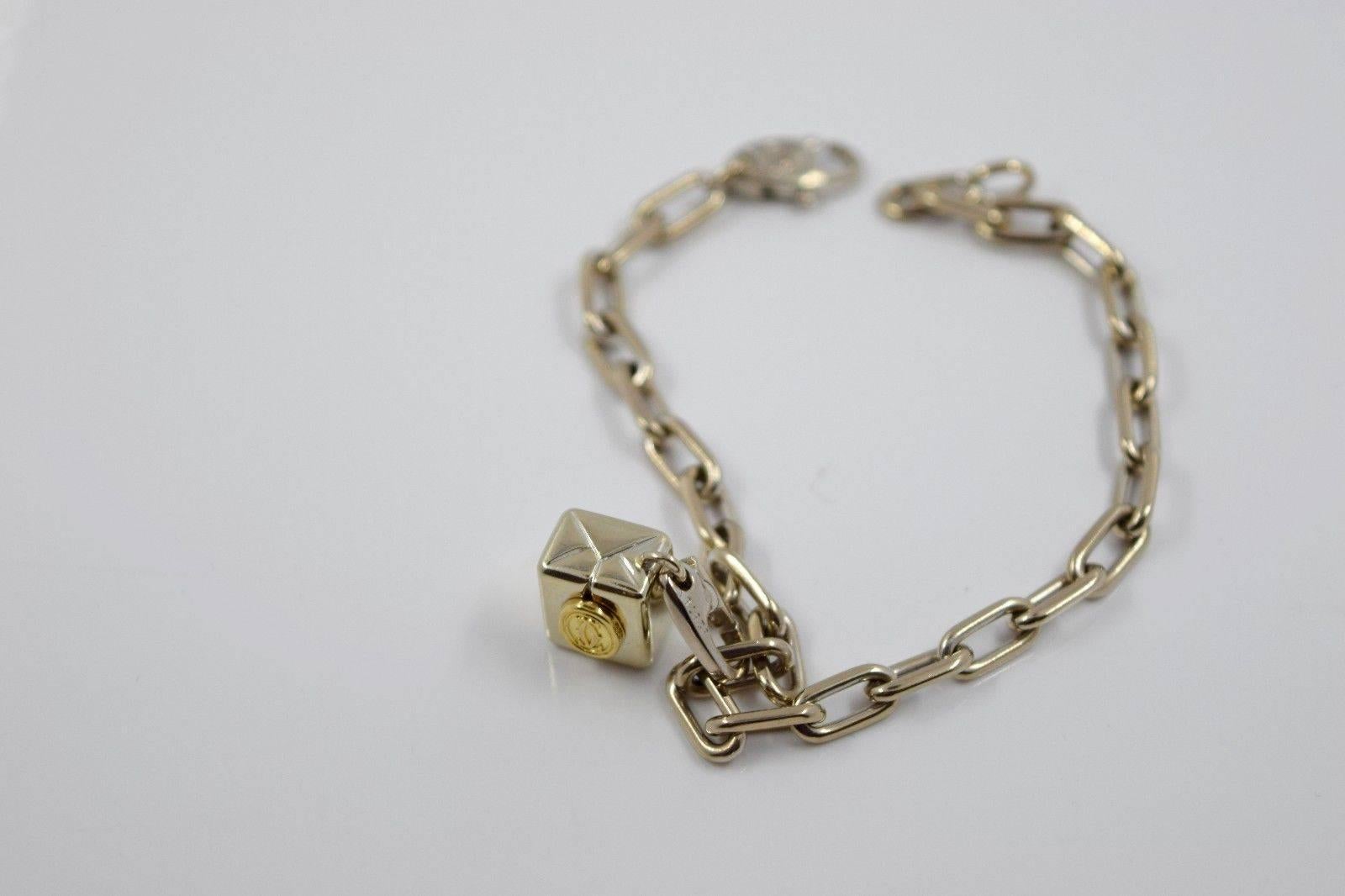 Cartier Double C Charm Bracelet

Classic and elegant 18K white and yellow gold charm bracelet; hanging double c cartier charm in center. Beautiful and chic for everyday wear. Hallmarks: Cartier, reference numbers, 750. Box included.