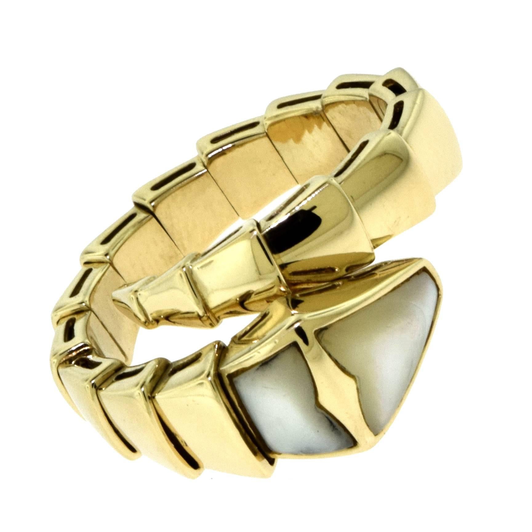 Designer: BVLGARI
Collection: Serpenti
Metal: Yellow Gold
Metal Purity: 18k
Stones: 2 Mother of Pearl Stones
Ring Size: Fits most sizes. Very flexible
Total Item Weight (g): 11.4
Hallmark: BVLGARI 750 m
Type: Wrap Around Finger Fashion Ring

Coiled