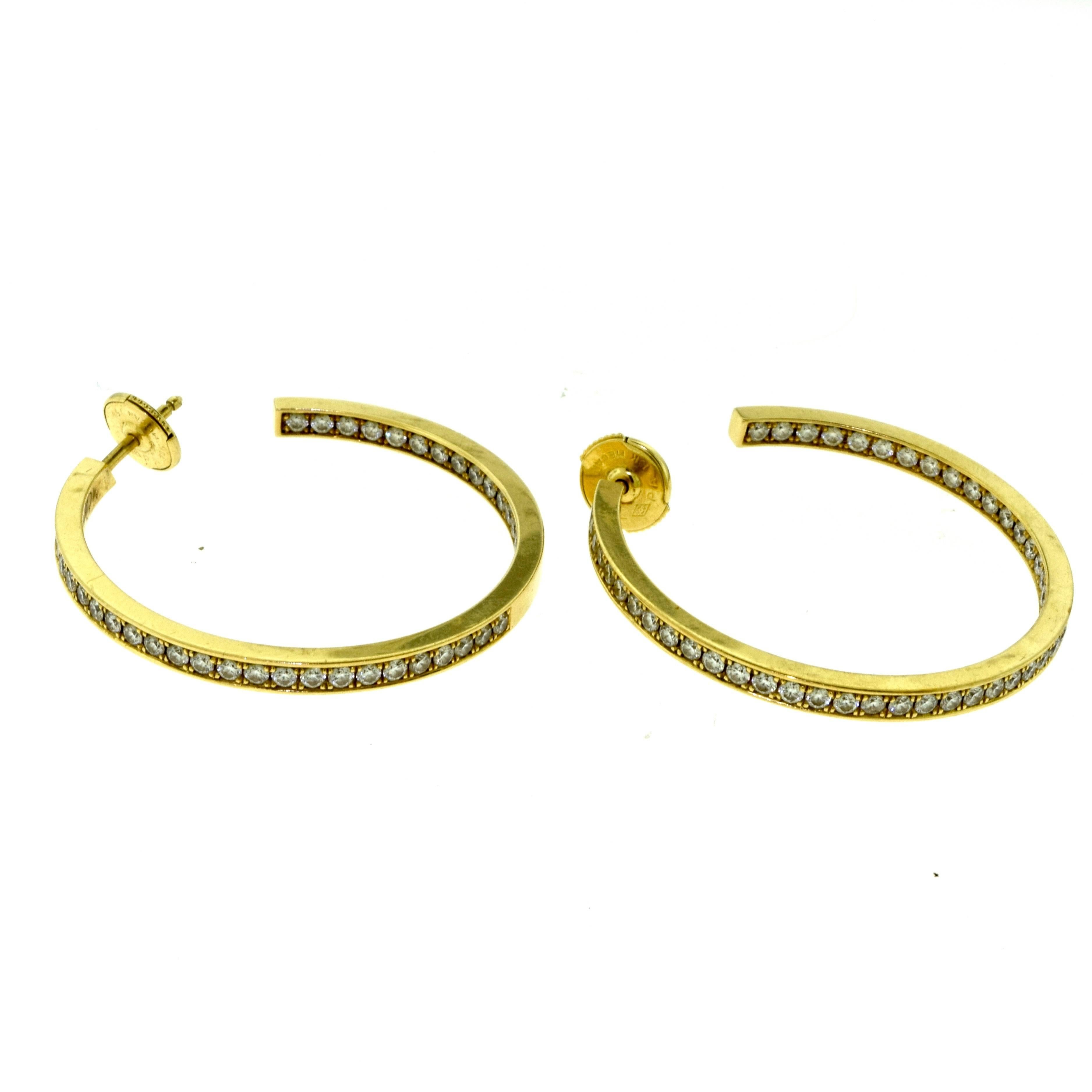Type: Hoop Earrings
Designer: Cartier
Metal: Yellow Gold
Metal Purity: 18k
Stones: Round Brilliant Diamonds
Total Carat Weight: 1.80 carat
Total Item Weight (g): 11.9
Earring Width: 2.69 mm
Earring Diameter: approx. 1.4 inches
Hallmarks: Cartier 750