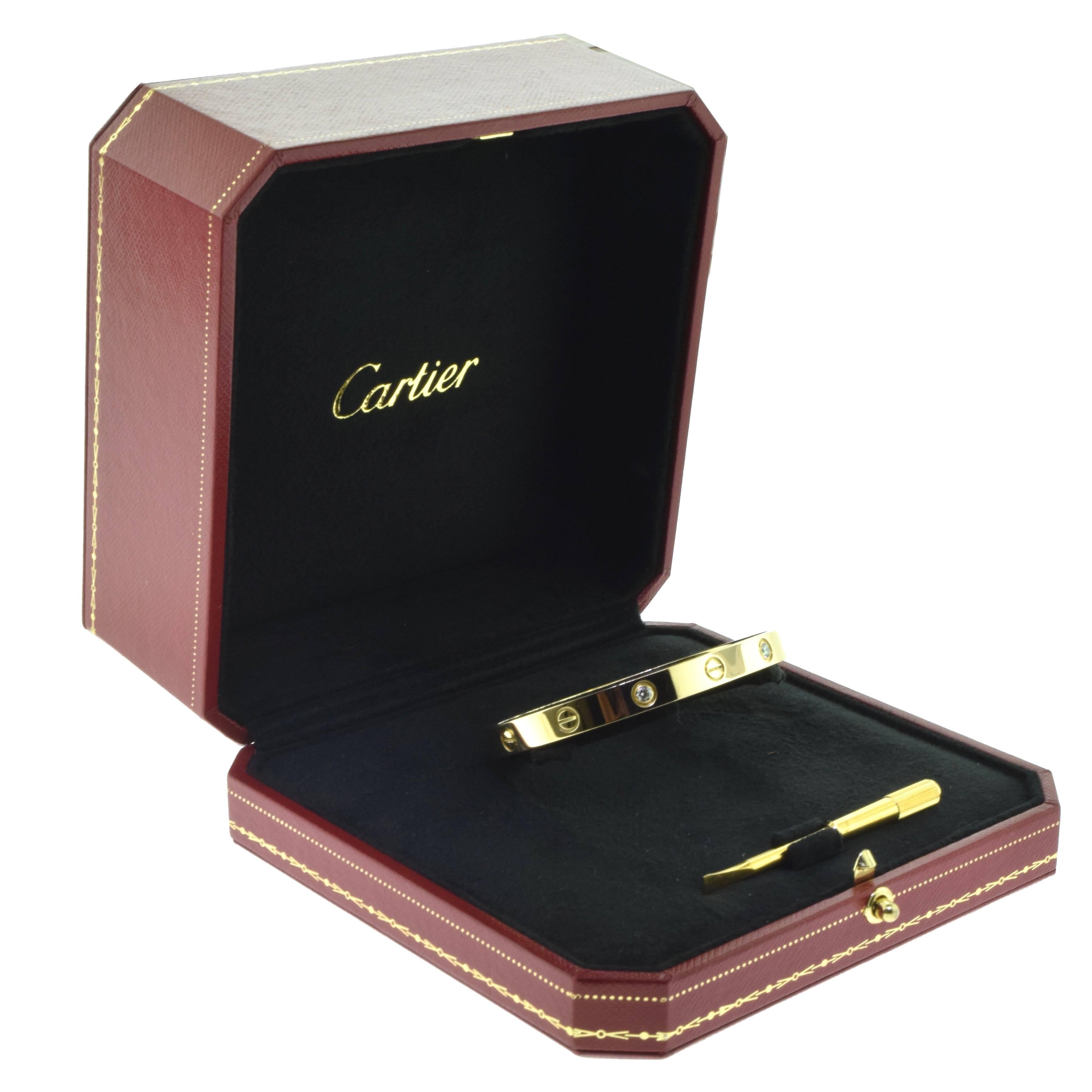 From Cartier's LOVE collection:
Bracelet Size: 17 = 17 cm   
Metal: 18 Karat Yellow Gold
Stones: 4 Round Brilliant Cut Diamonds 
Total Carat Weight: 0.42 ct
Total Item Weight (g): 30.9
Hallmark: Cartier 750 Serial No. 17
Collateral: Certificate of