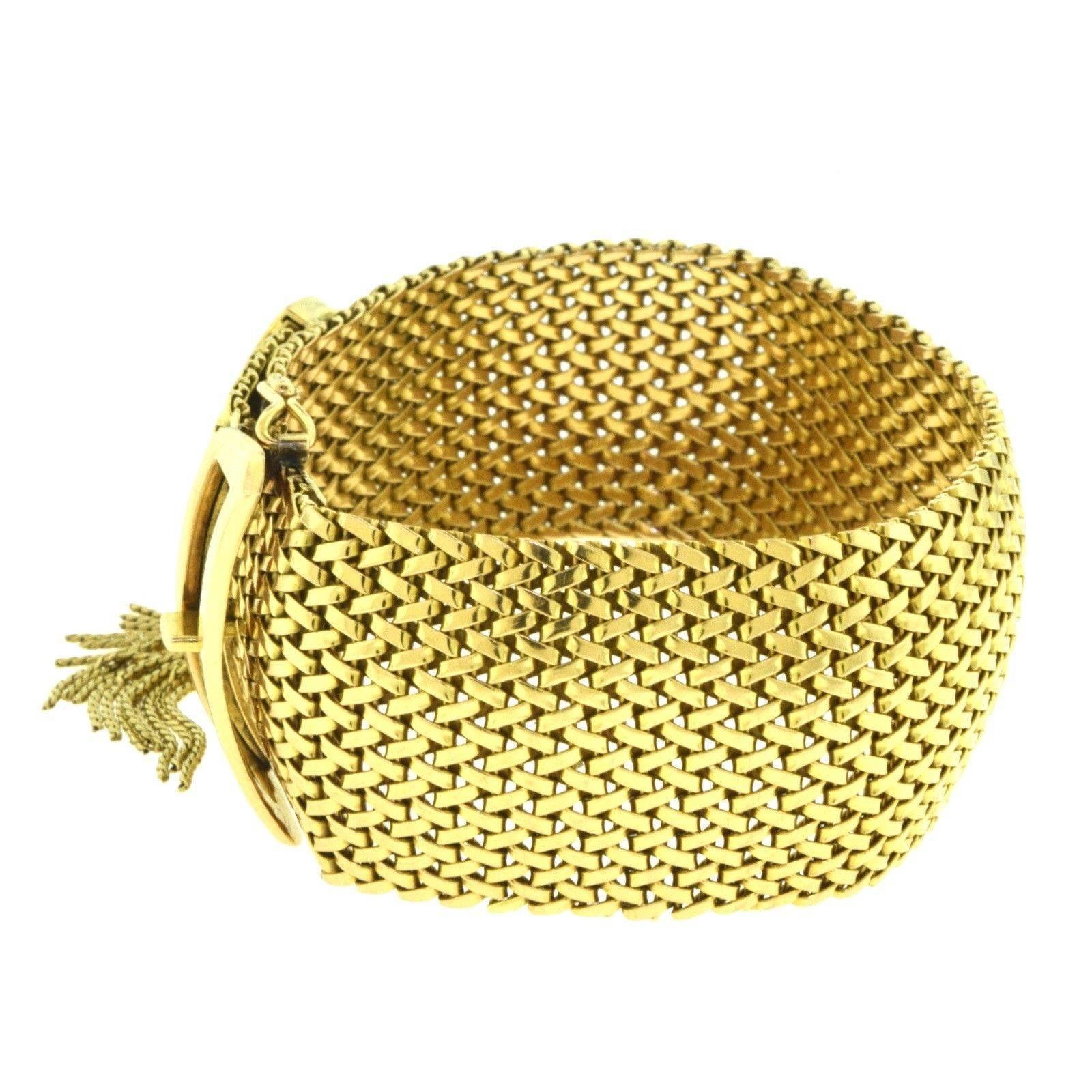 A gorgeous statement piece. This 18k yellow gold wide mesh belt buckle bracelet with gold fringe hangs beautifully on your wrist to showcase its exquisiteness. 

Era: Estate
Metal: Yellow Gold
Metal Purity: 18k​​​​​​​
Total Item Weight (g):