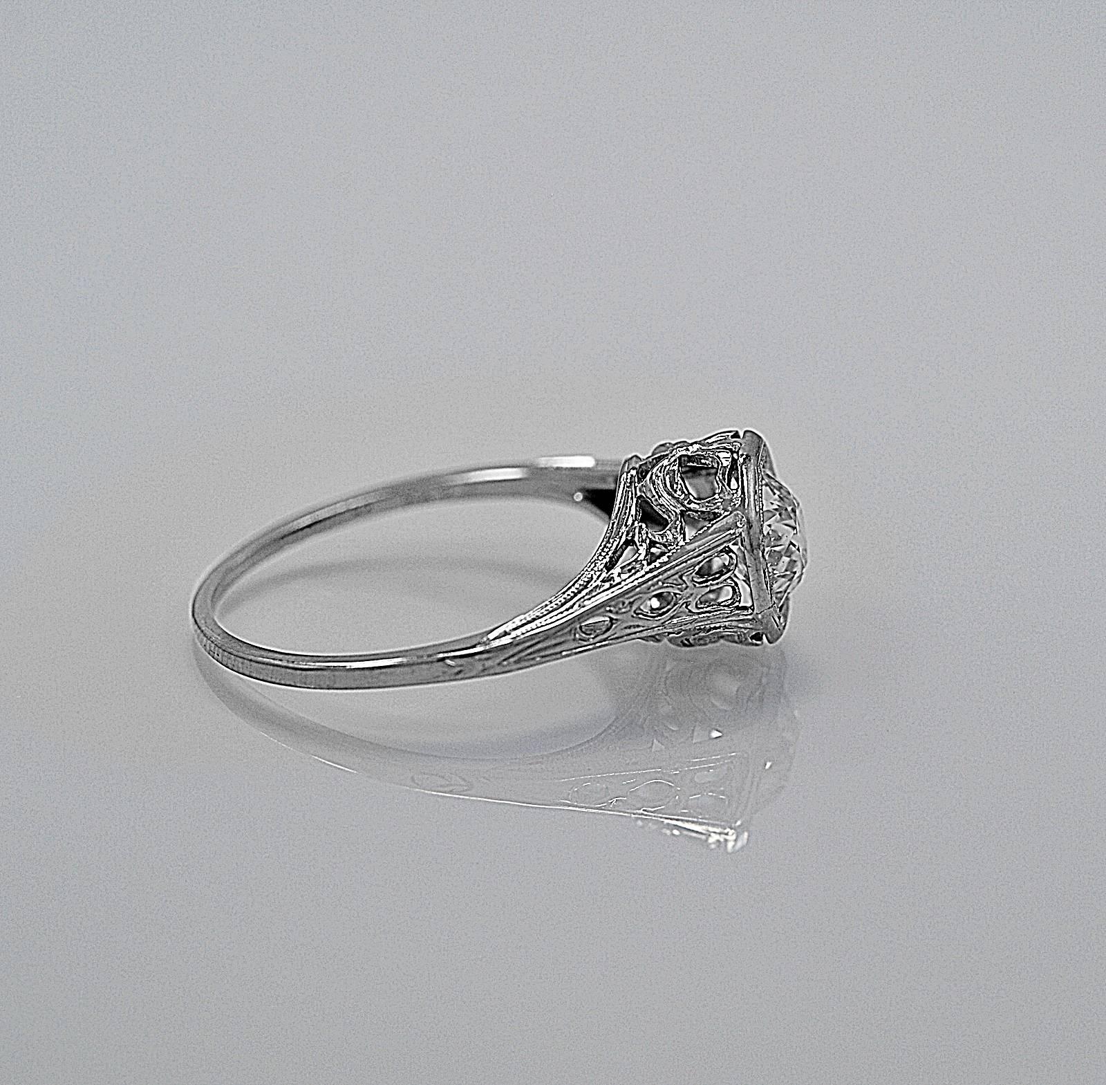 A wonderful vintage engagement ring featuring a .95ct. apx. European cut diamond with SI1 clarity and I-J color. The diamond is set in an octagon shaped setting which showcases this stunning round diamond. This lovely diamond vintage engagement ring
