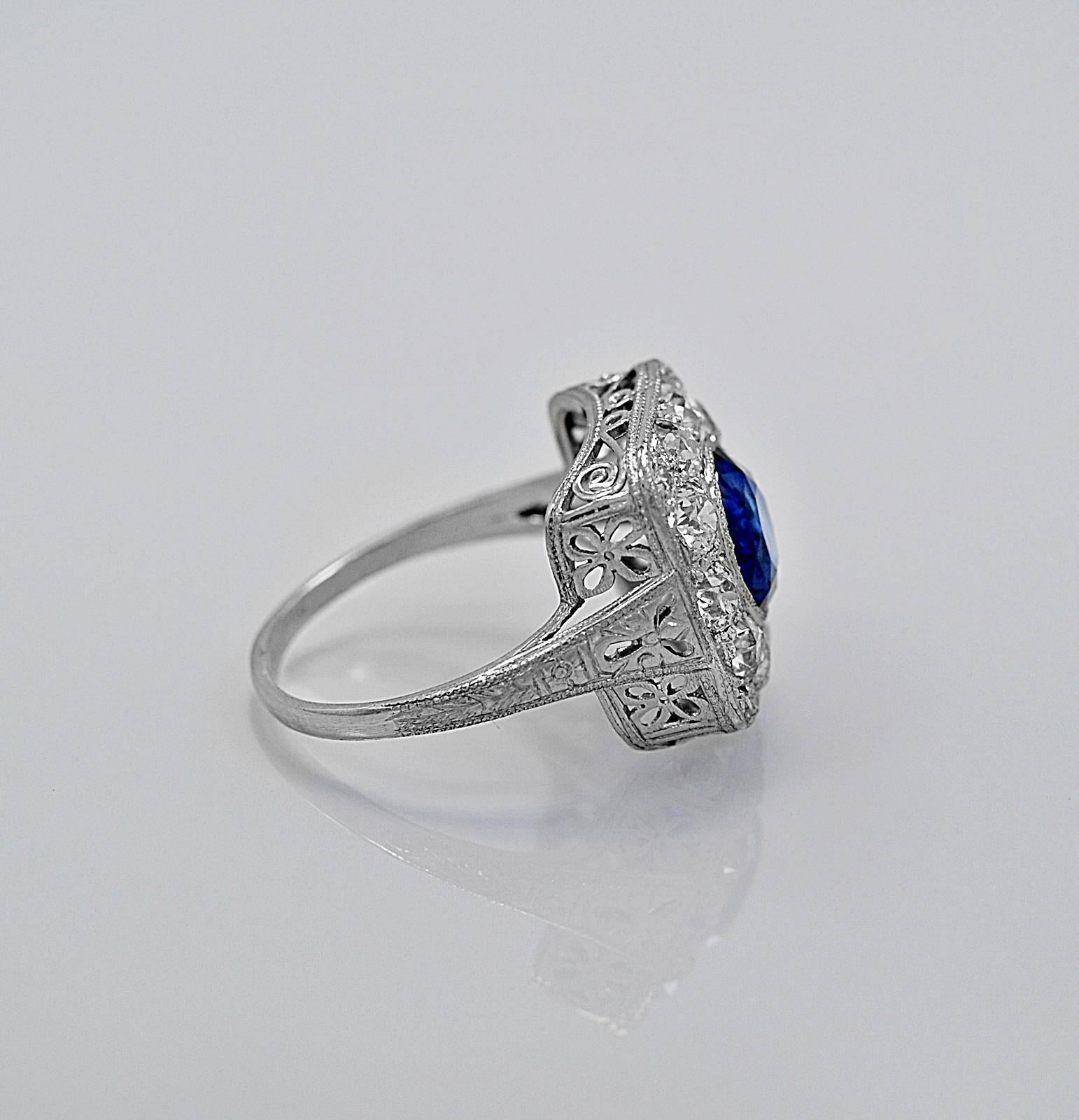 A superbly crafted Art Deco sapphire and diamond antique engagement ring or fashion ring featuring a 2.50ct. apx. natural blue sapphire of exceptional quality and 1.50ct. apx. T.W. of dazzling European cut diamonds. Notice the outstanding filigree!