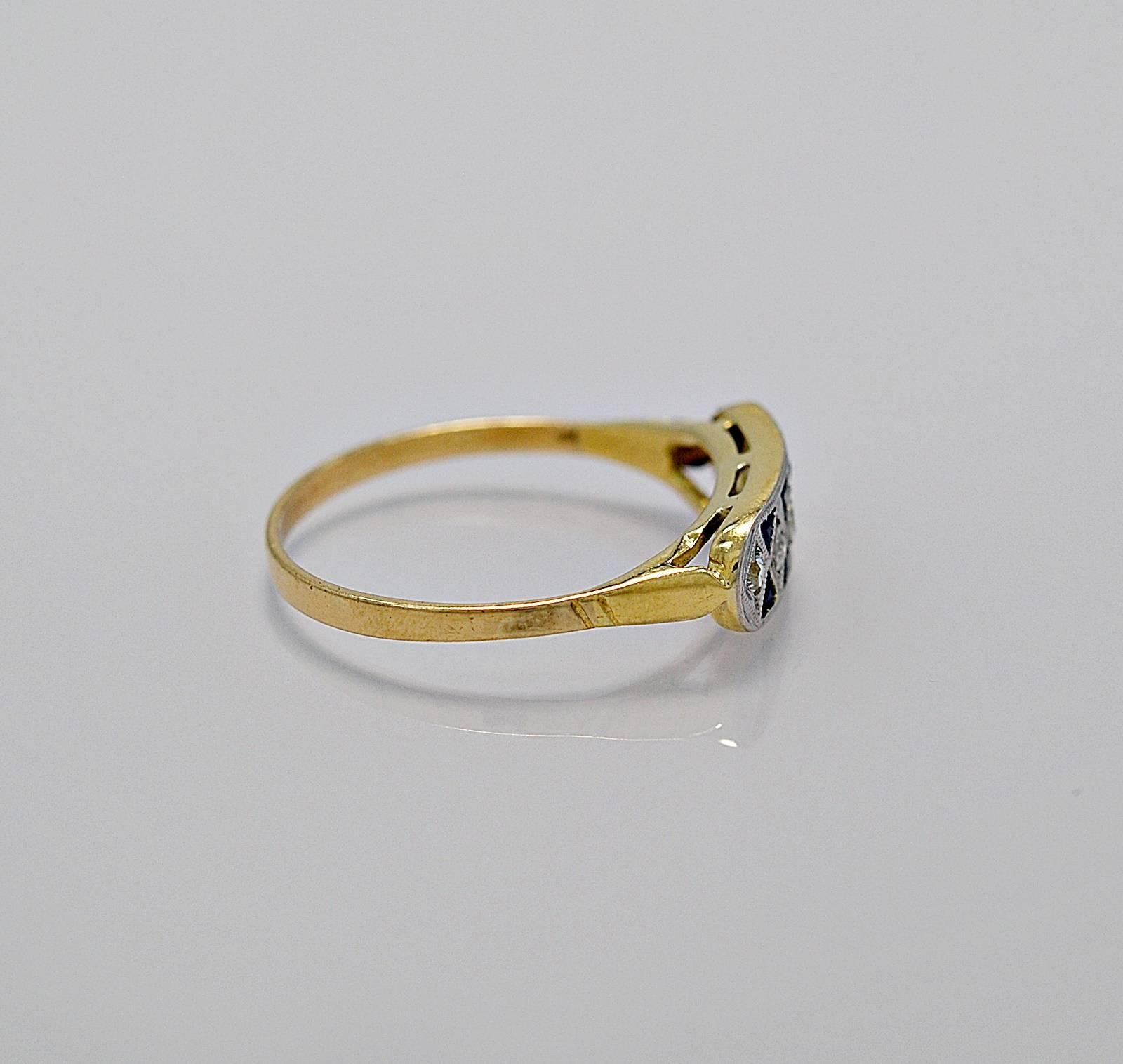 A wonderful antique wedding band featuring .25ct. T.W. of triangular cut sapphires and .15ct. apx. T.W. of single cut diamonds. This ring is from Argentina's high society in Buenos Aires which is the home of the Tango and the incomparable Carlos