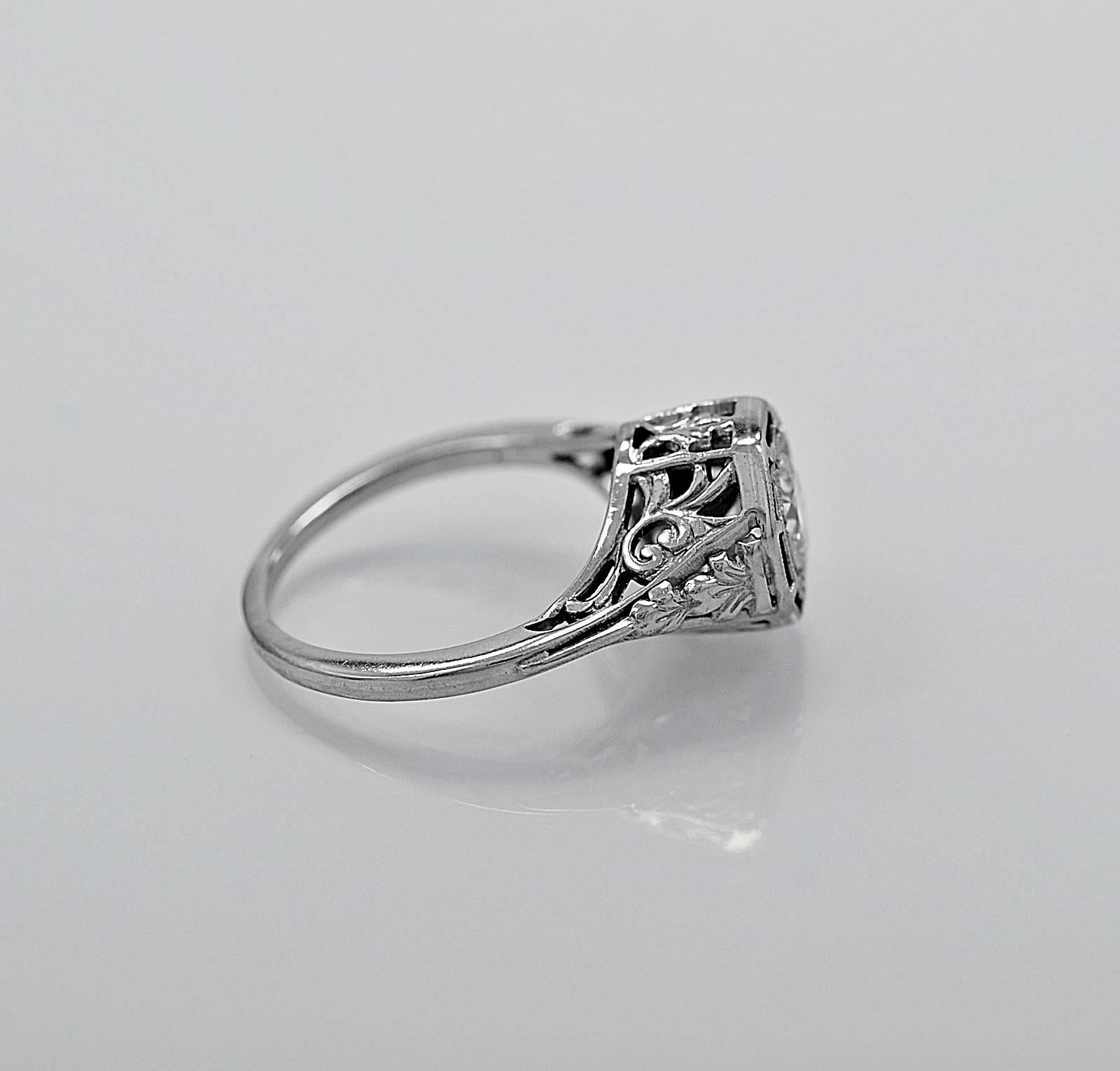 This gorgeous 18K White Gold Art Deco antique engagement ring by 