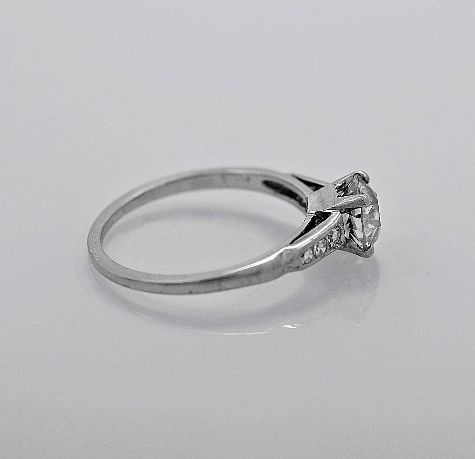 This lovely Art Deco diamond & platinum antique engagement ring features a 1.00ct. apx. European cut diamond with SI3 clarity and L-M color. It has an additional .10ct. T.W. apx. of melee single cut diamonds. Gorgeous! 

Primary Stone(s): Diamond