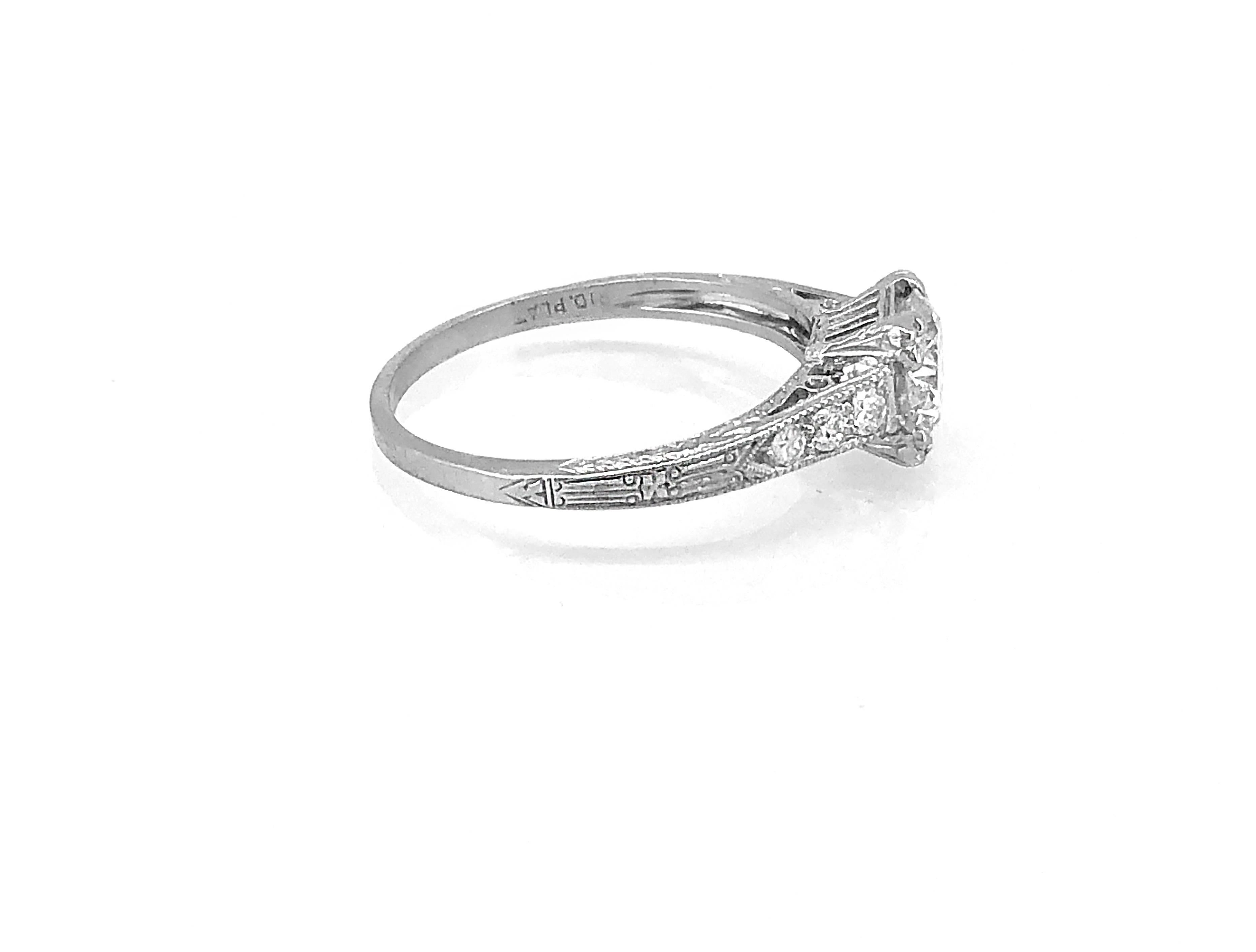 An exquisite Art deco diamond Antique Engagement ring that features a sparkling 1.01ct. apx. transitional cut diamond with VVS2 clarity and L-M color. Accenting the center diamond are .18ct. apx. T.W. of transitional cut diamonds with VS2-SI1