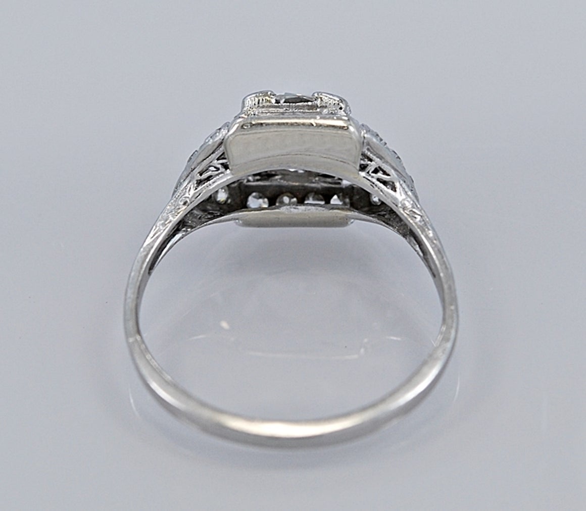 J35028

This is a spectacular Art Deco Diamond & Platinum Engagement Ring. It features a 1.23ct. European cut diamond. It is VS1 clarity and G-H color. The side diamonds are marquise shape and single cut, which adds a touch of class. This